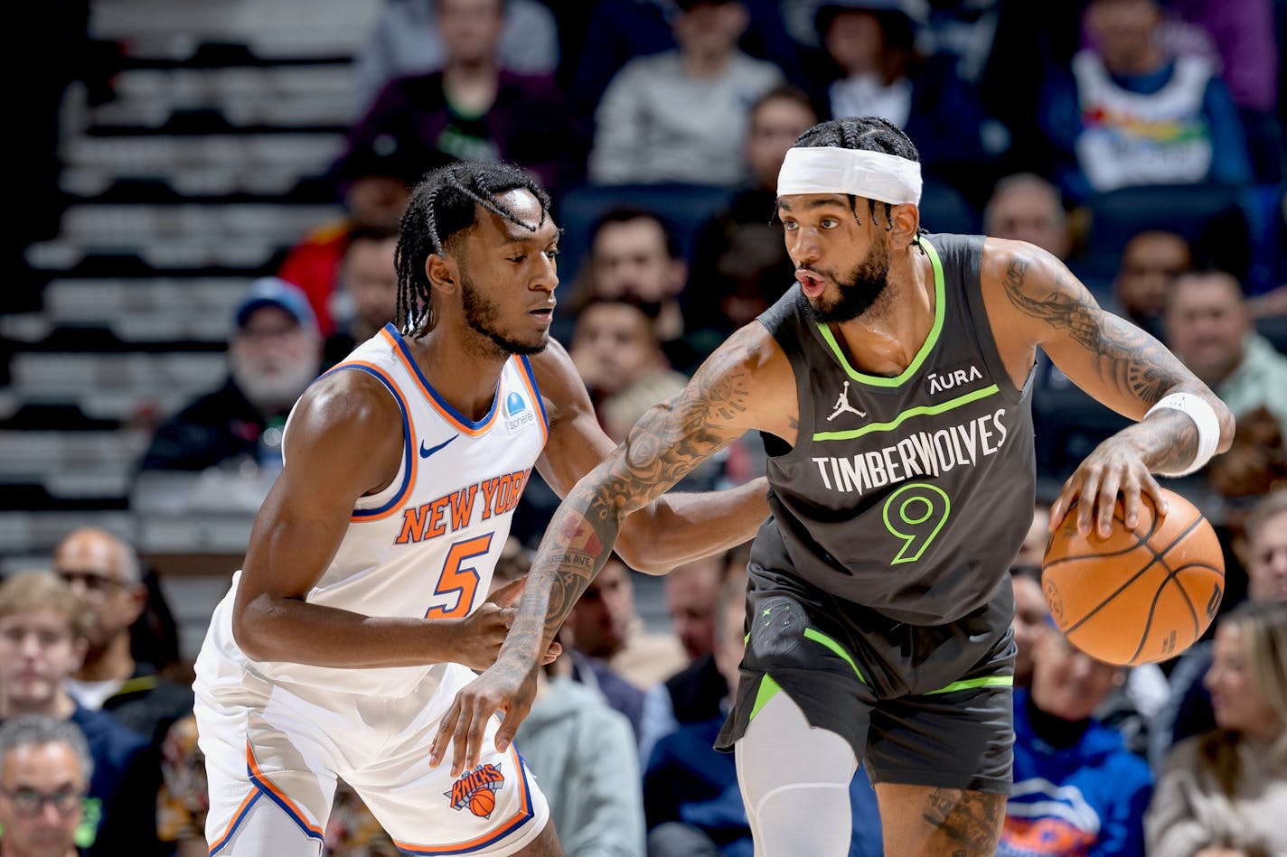 Immanuel Quickley (5) of the New York Knicks defends Nickeil Alexander-Walker (9) of the Minnesota Timberwolves in the first quarter Monday, November 20, 2023, at Target Center in Minneapolis, Minn. ] CARLOS GONZALEZ • carlos.gonzalez@startribune.com