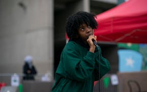 Dua Saleh, backed by Hlpwntd sang on the plaza outside he Cedar Cultural Center Monday afternoon. ] JEFF WHEELER • jeff.wheeler@startribune.com Ther