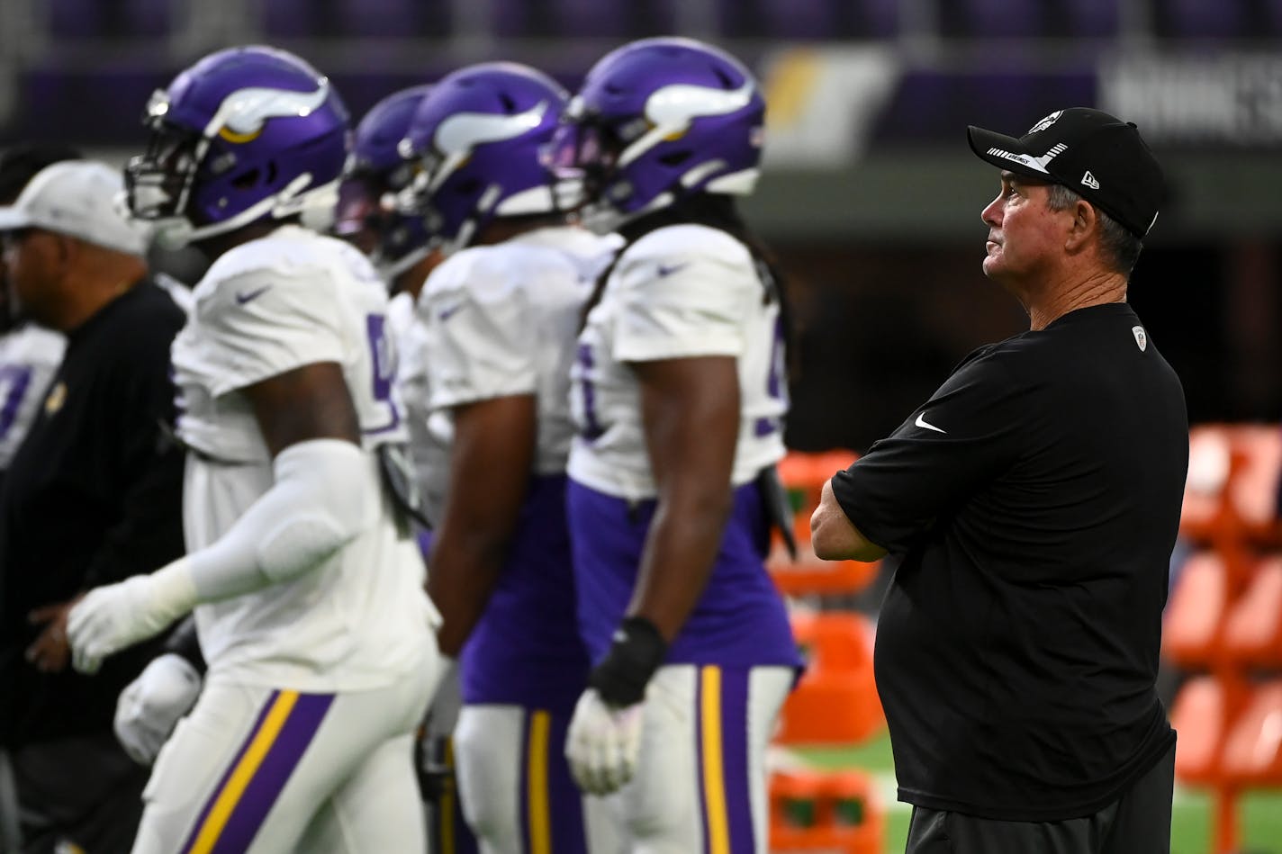 Minnesota Vikings head coach Mike Zimmer watched the team practice Saturday at U.S. Bank Stadium.