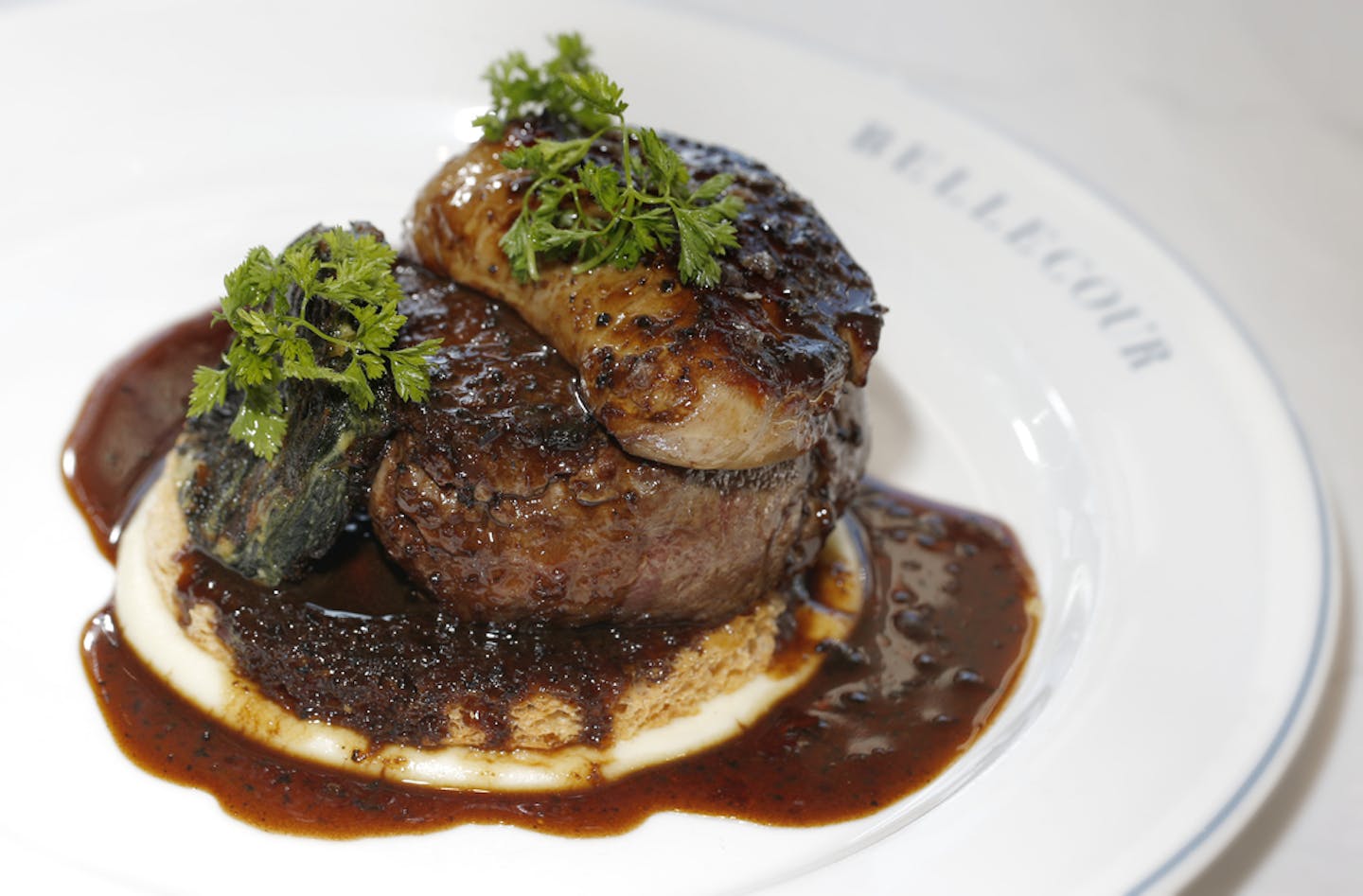 Beef Rossini, dish of of Bellecour TOURNEDOS ROSSINI
filet mignon, foie gras, sauce p&#x17d;rigourdine ___ Chef of the Year: Profile of our 2017 chef of the year, Gavin Kaysen of Bellecour in Wayzata and Spoon and Stable in Minneapolis. Chef Gavin Kaysen of Bellecour, prepared several dishes including: beef tartare, beef Rossini, bouillabaise, pheasant pate. Also, they have an engaging bakery counter/cafe that is open during the day.