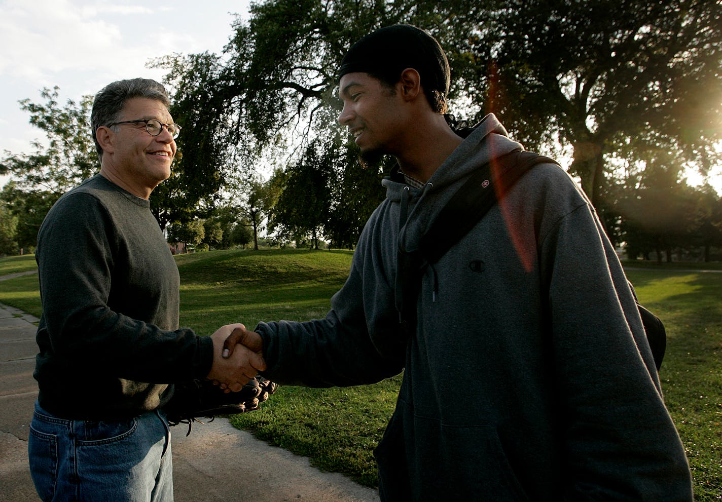 Minnesota Senatorial candidate Al Franken was greeted by a passerby as he made his way to play catch with a staff member at a park at S. Chicago Avenue and E. Franklin Steet.