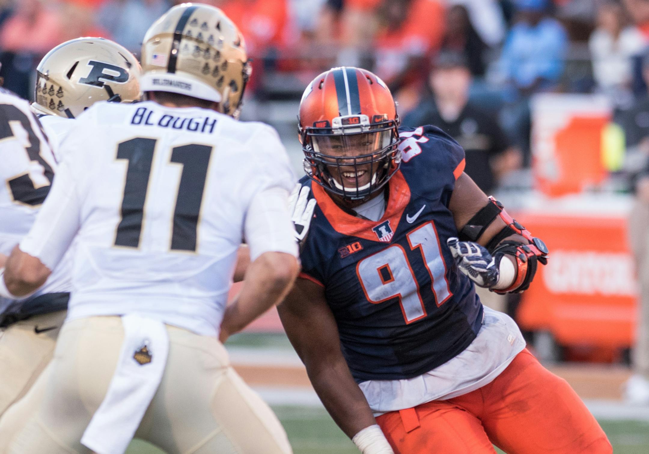 Illinois defensive lineman Dawuane Smoot (91) pushes Purdue quarterback David Blough (11) during an NCAA college football game Saturday, Oct. 8, 2016 at Memorial Stadium in Champaign, Ill. (AP Photo/Bradley Leeb)