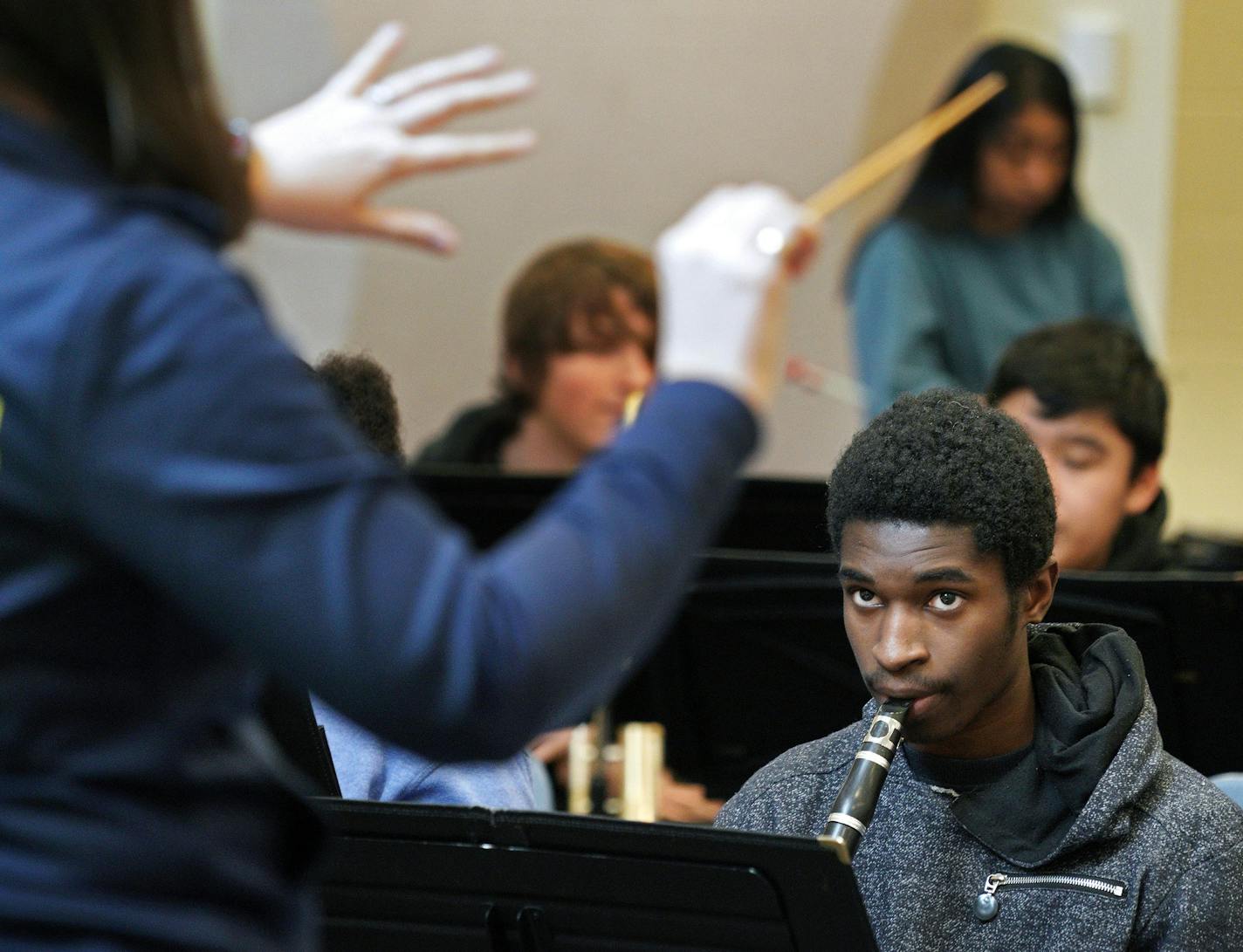 Clarinet player Peter Asamoah is attentive to Minneapolis' Edison High School band teacher Lesley Earles during practice. Earles is working around the clock to keep music alive in her school where resources are tight and many of her low-income students aren't familiar with music education. In the few years she has been at Edison, she has grown the band class from 15 students to 80 students. She started a drum-line, a jazz band, created a music festival for all northeast schools, and started taki