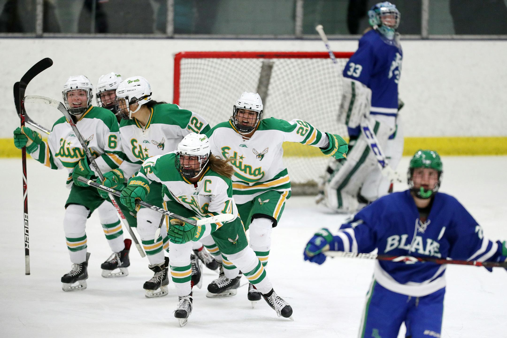 Edina's Aliyah Lance (22) and Emily Oden (16) celebrated after scoring against Blake School.