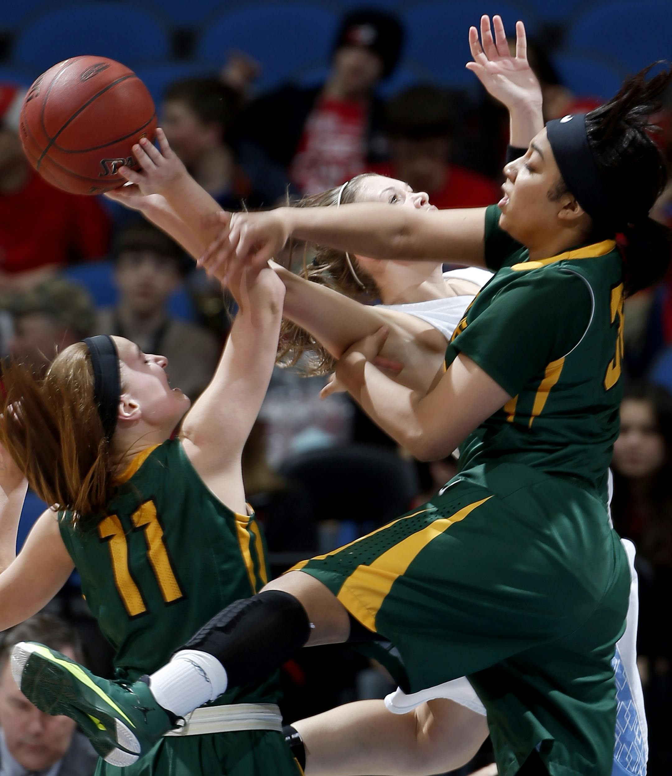 Ann Simonet (11) and Camille McCoy (32) of Park Center teamed up to block a shot by a Simlley player in the second half. ] CARLOS GONZALEZ cgonzalez@startribune.com - March 18, 2014 , Minneapolis, Minn., Target Center High School / Prep basketball quarterfinals, Class 3A girls quarterfinals; #1 Park Center vs. Simley, 6 p.m.;