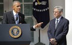 Federal appeals court judge Merrick Garland, right, stands with President Barack Obama as he is introduced Wednesday as Obama's nominee for the Suprem