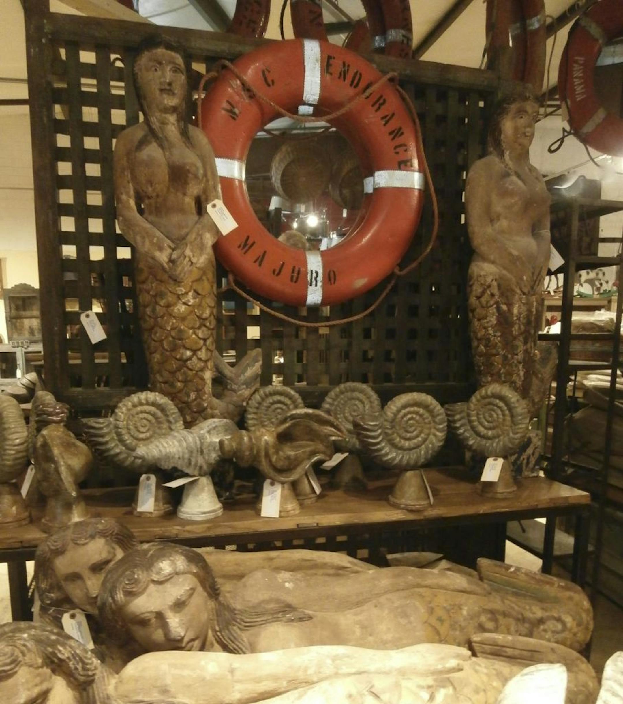 SH12E186NAUTICALDECOR May 28, 2012 -- Blue Ocean Traders has vintage life preservers from old Eastern European vessels as well as reproduction mermaid figureheads.