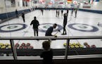 Sullivan Panger watched the curlers through the restaurant glass at the Four Seasons Curling Club in Blaine, Minn., Wednesday, January 29, 2020.