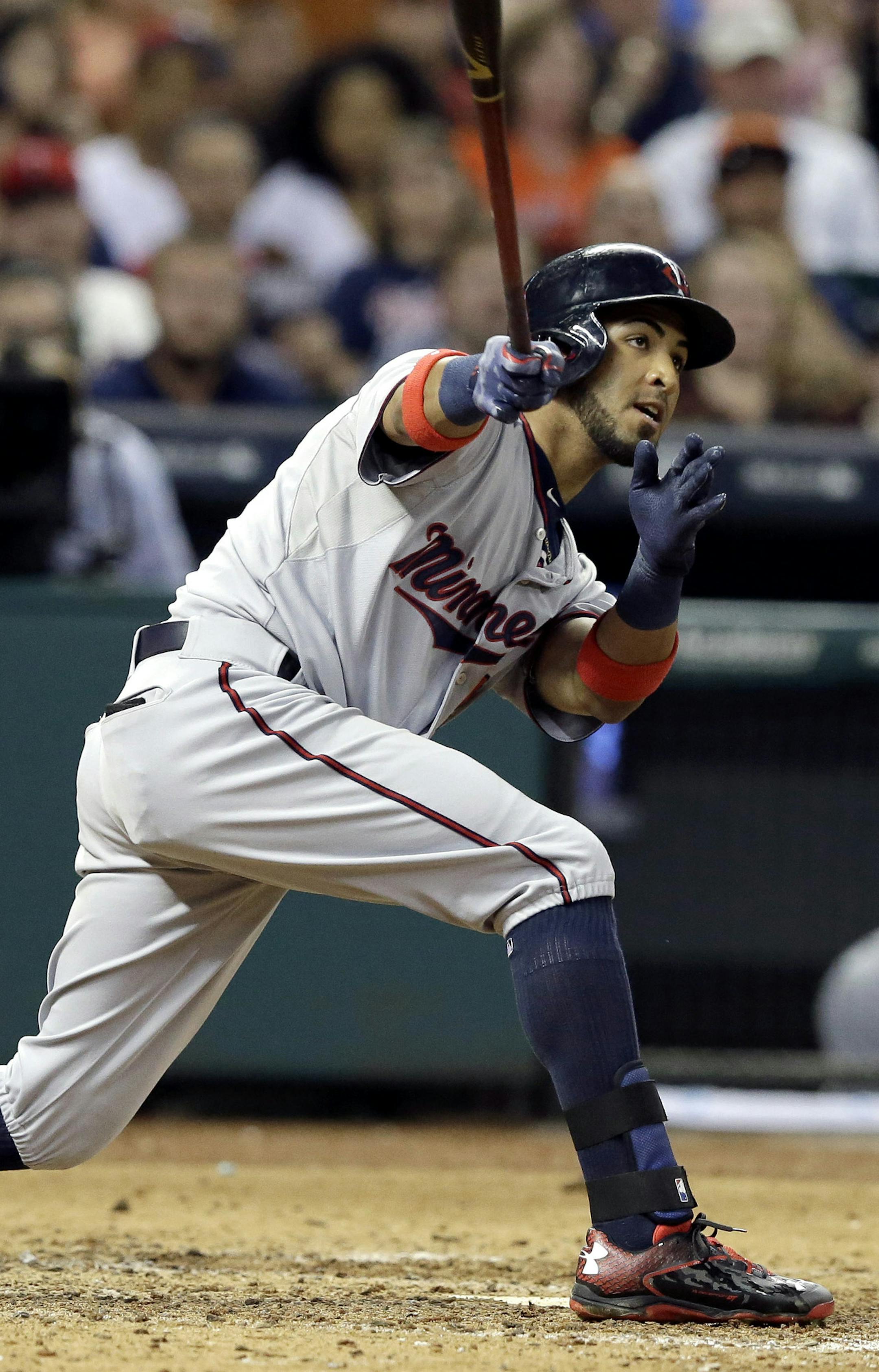 Minnesota Twins' Eddie Rosario watch as the ball goes long to right field for a two-run triple against the Houston Astros in the ninth inning of a baseball game Saturday, Sept. 5, 2015, in Houston. (AP Photo/Pat Sullivan)