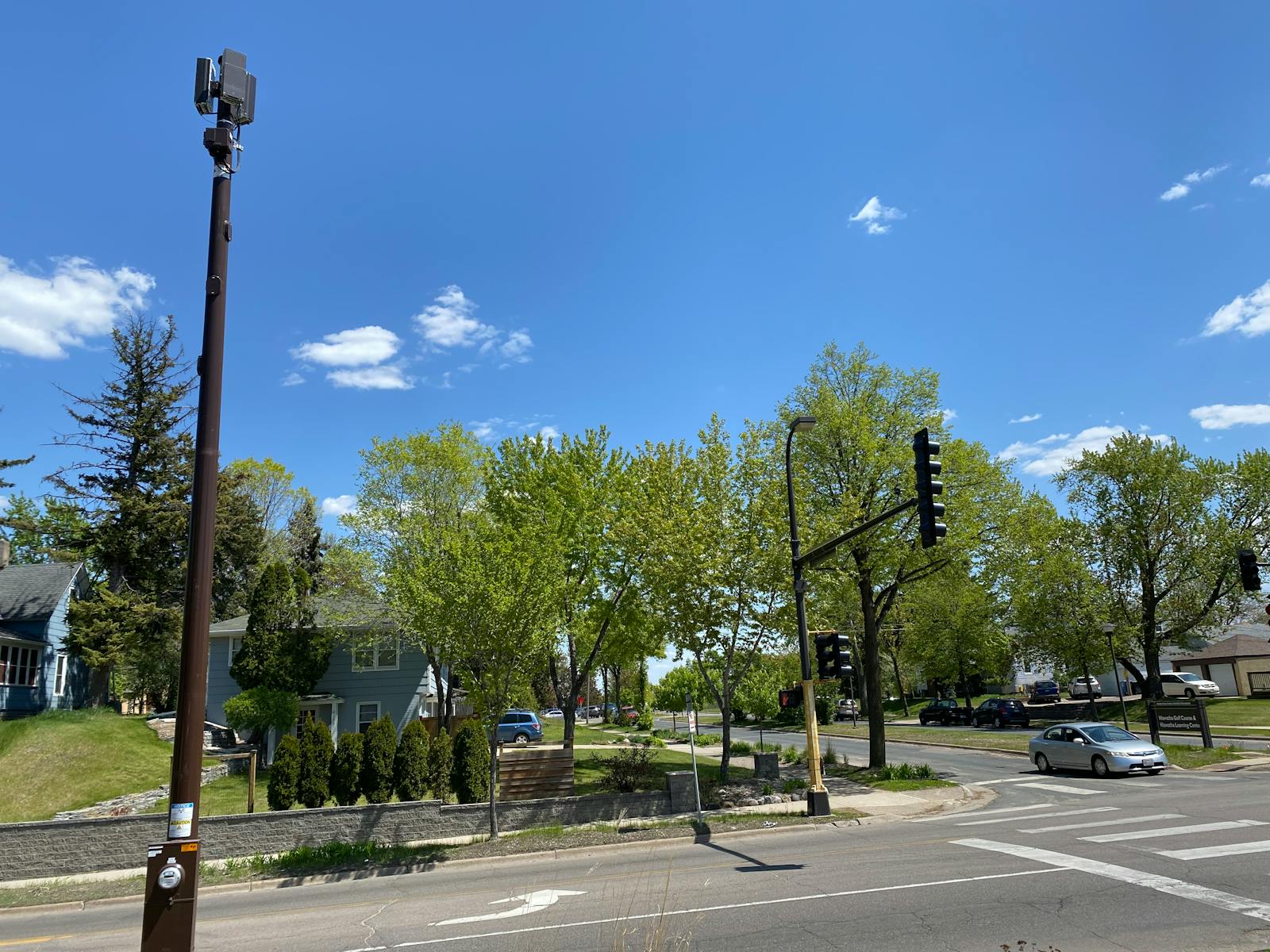 The new cellular pole, at left, outside Roy Vanderwerf’s house in south Minneapolis.