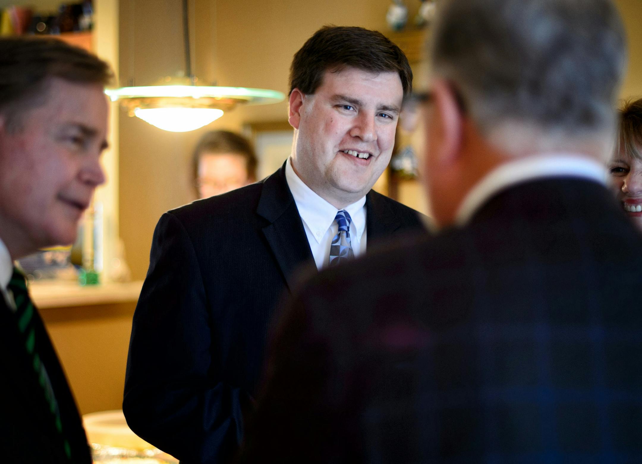 Mike Obermueller, center, DFL challenger to Rep. John Kline for the second congressional district, spoke at an Apple Valley fund raiser with DFL candidate for House in 57A Bruce Folken. ] Thursday, September 25, 2014