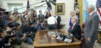 President Donald Trump speaks to members of the media after signing an executive order to end family separations at the border, during an event in the
