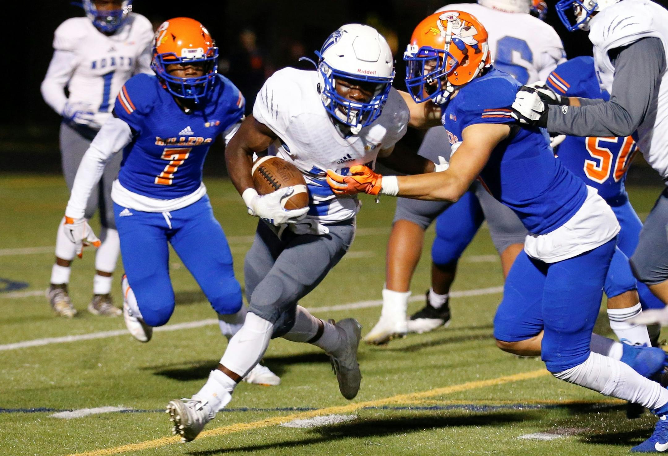 Minneapolis North's Terrance Kamara (2) looks for extra yardage against Minneapolis Washburn Friday night. Kamara had three rushing TDs in the Polars' 25-0 victory over the Millers at Washburn High School. Photo by Jeff Lawler, SportsEngine