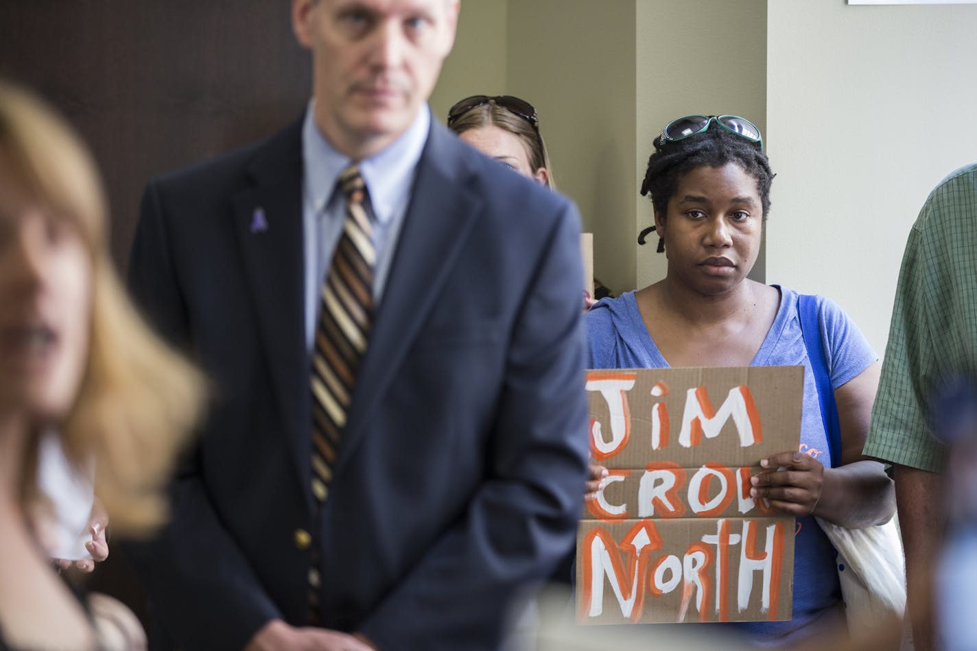 Loretta Vanpelt, with the Twin Cities Coalition for Justice for Jamar, held a sign during a protest in the lobby at the Ramsey County Attorney's office in downtown St. Paul, Minn., on Friday, July 15, 2016. ] RENEE JONES SCHNEIDER &#x2022; reneejones@startribune.com