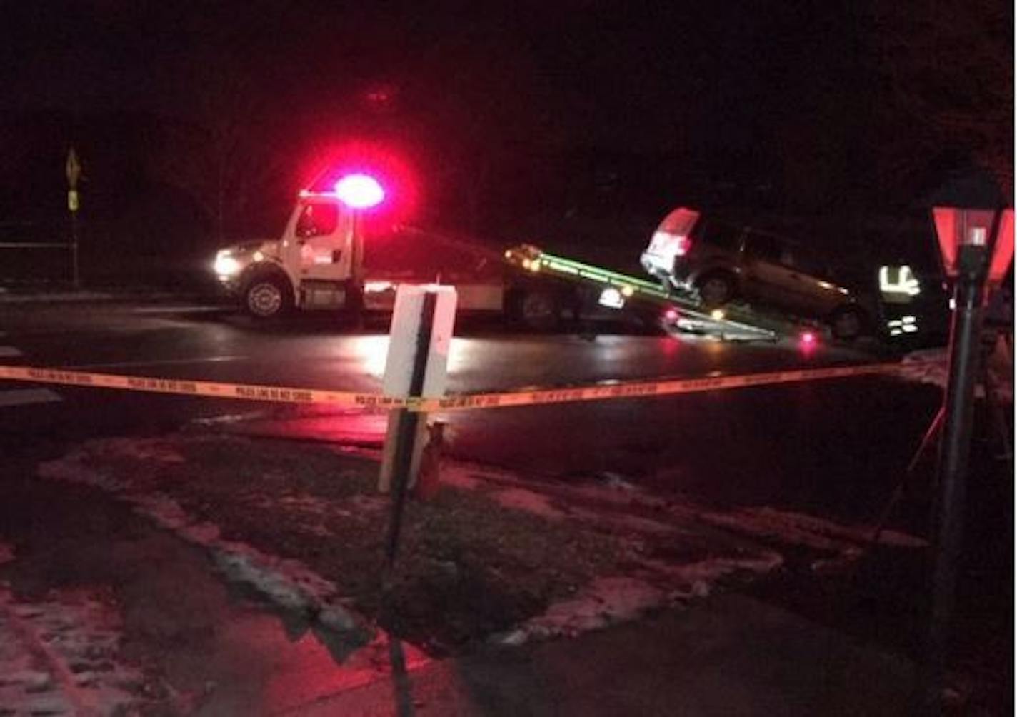 The vehicle involved in Friday night's crash in St. Paul that killed one pedestrian and seriously injured the other was towed away.