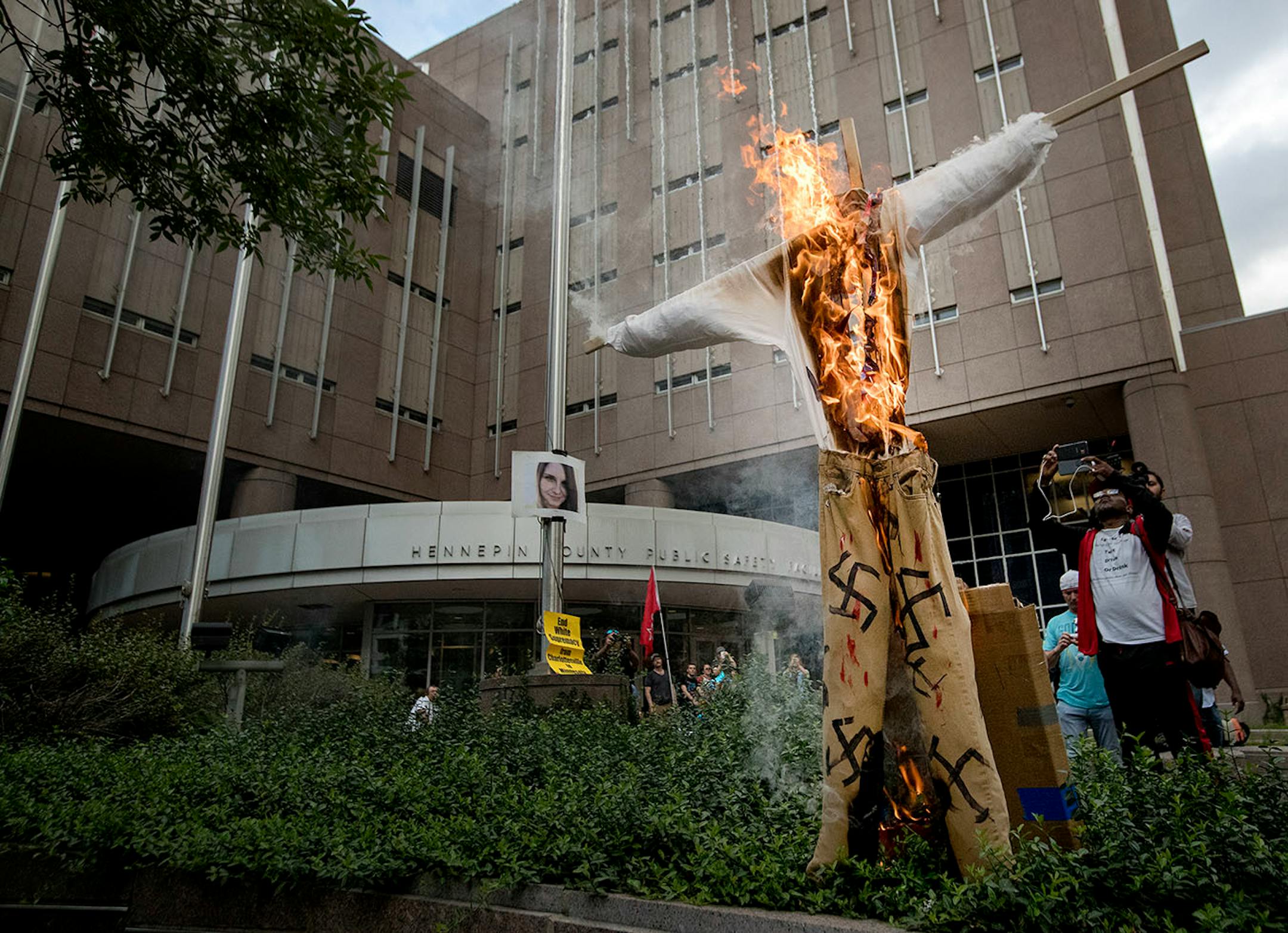 Demonstrators burned a swastika covered figure during the Solidarity with anti-racists in Charlottesville march that ended in downtown Minneapolis on Monday.