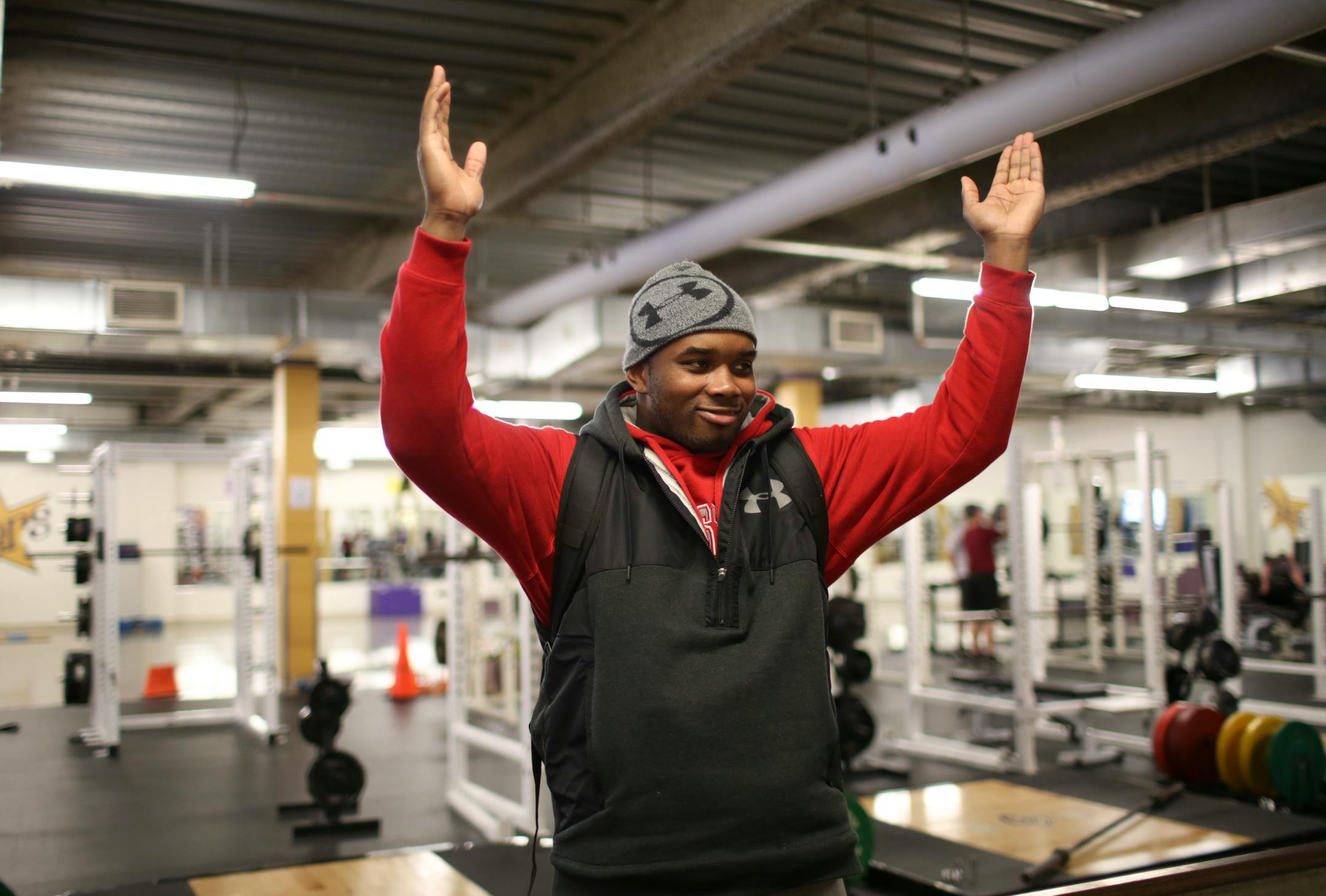 Jashon Cornell made the Ohio State University "O" sign for a couple of his former coaches during a 2015 visit to the weight room at Cretin-Derham Hall.