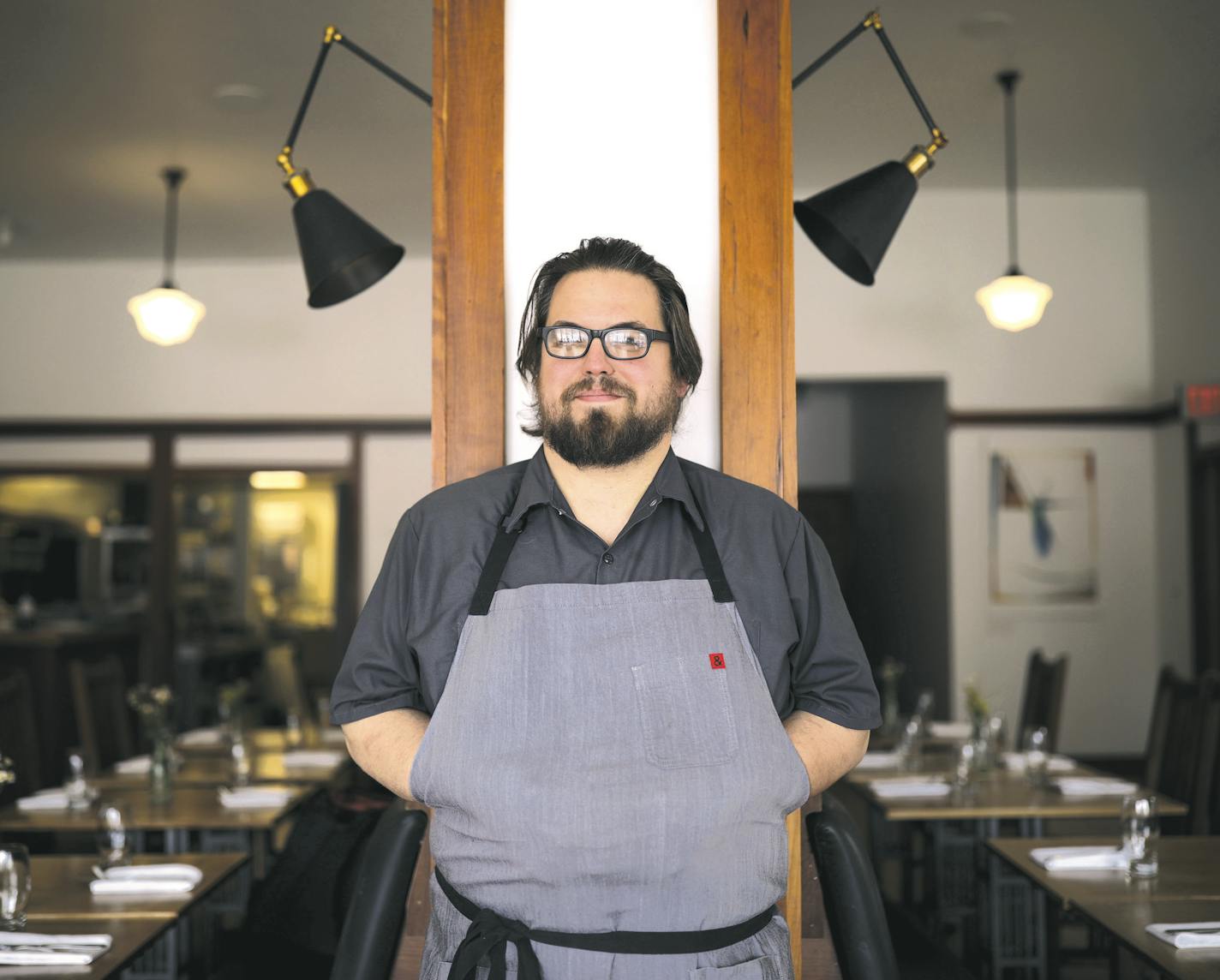 Chef/owner Andrew Kraft in the dining room of his Bungalow Club in the Longfellow neighborhood.