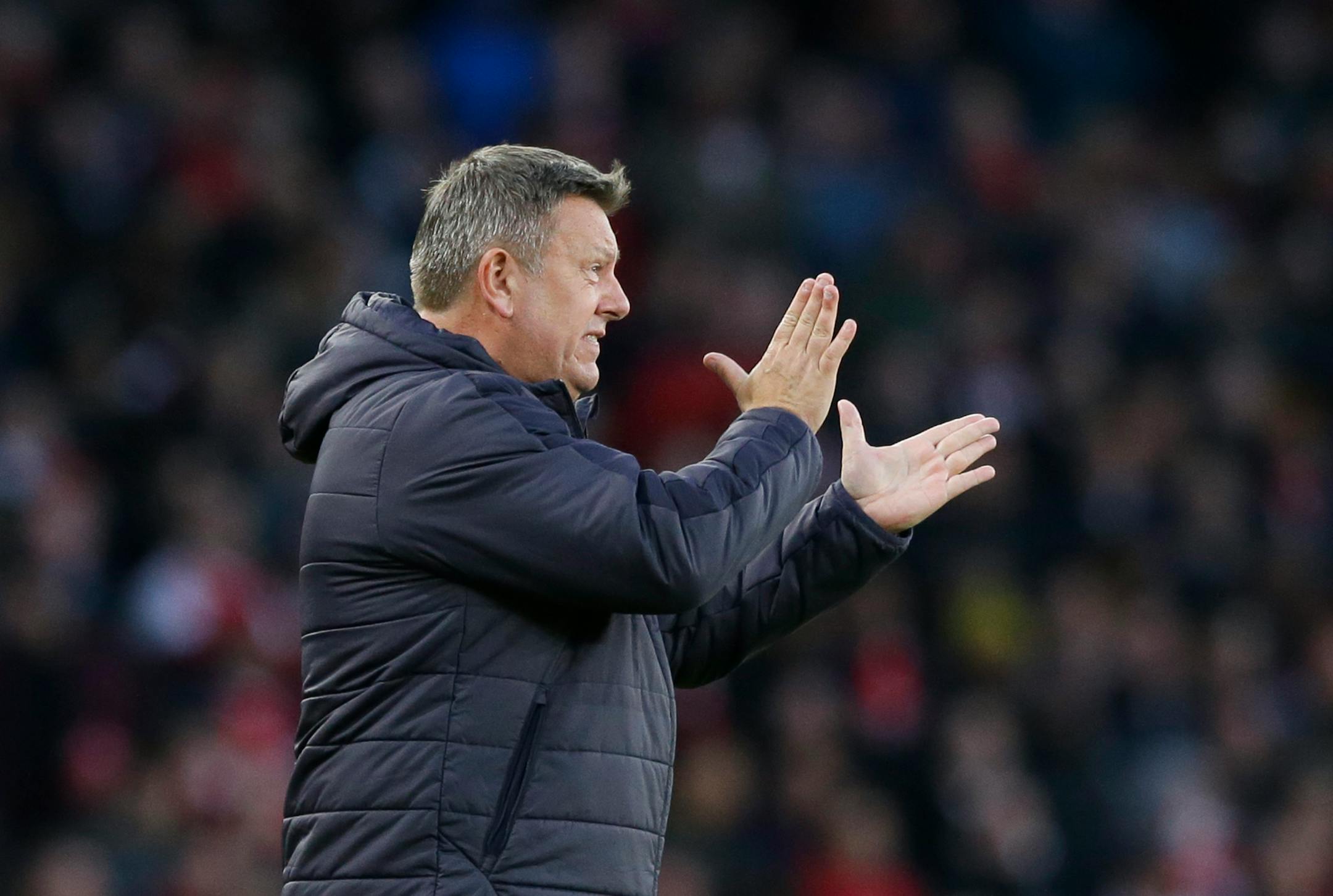 Leicester City's manager Craig Shakespeare gestures towards his players during the English Premier League soccer match between Arsenal and Leicester City at the Emirates Stadium in London, Wednesday, April 26, 2017. (AP Photo/Alastair Grant)