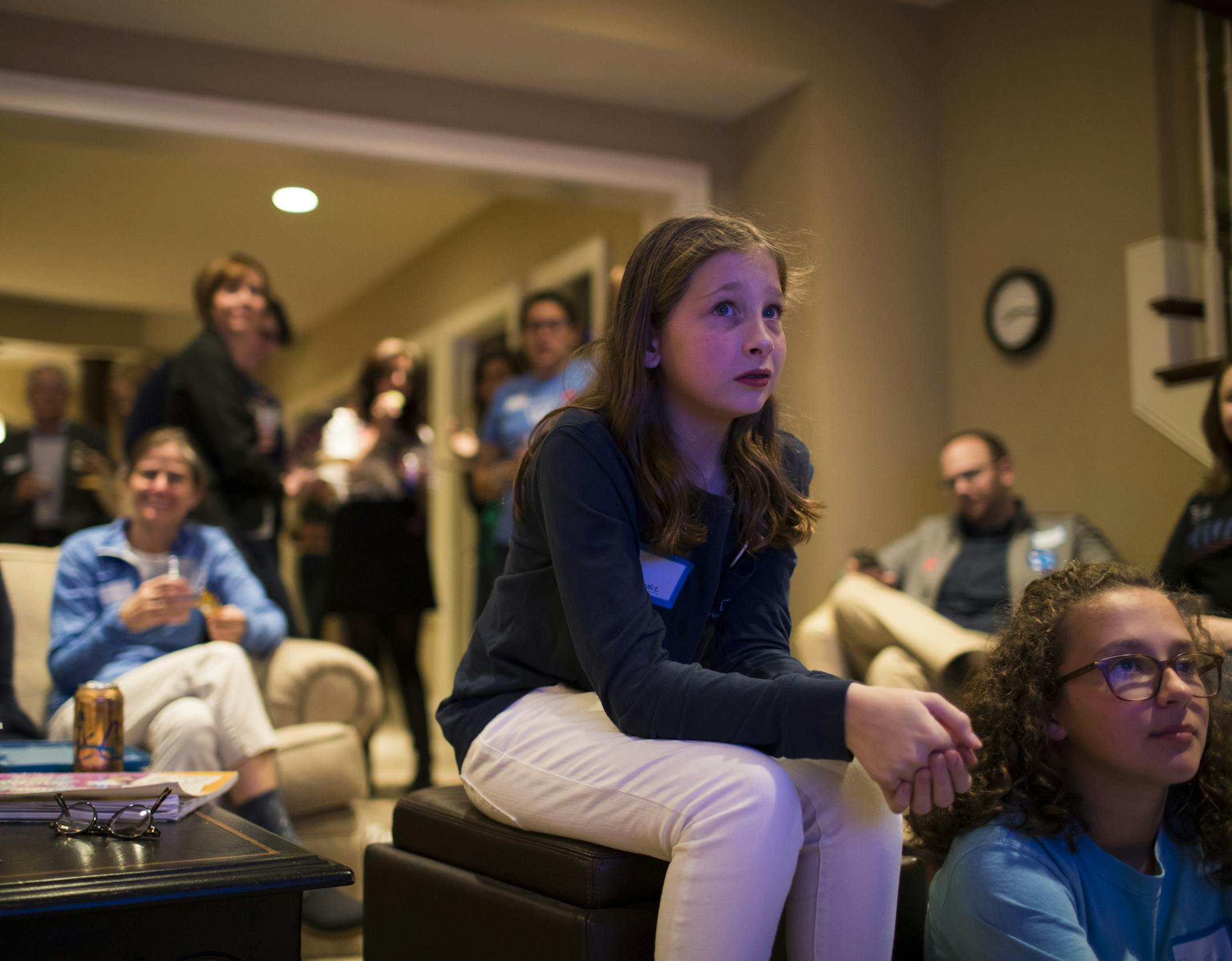 Caroline Pearce, 12, watched election results come in on the television early during an election party for Wellesley Alumni supporting Hillary Clinton at the home of Sara ('94) and Nick Pearce on Tuesday, November 8, 2016, in Edina, Minn. Hillary Clinton is a graduate of Wellesley College. ] RENEE JONES SCHNEIDER • renee.jones@startribune.com