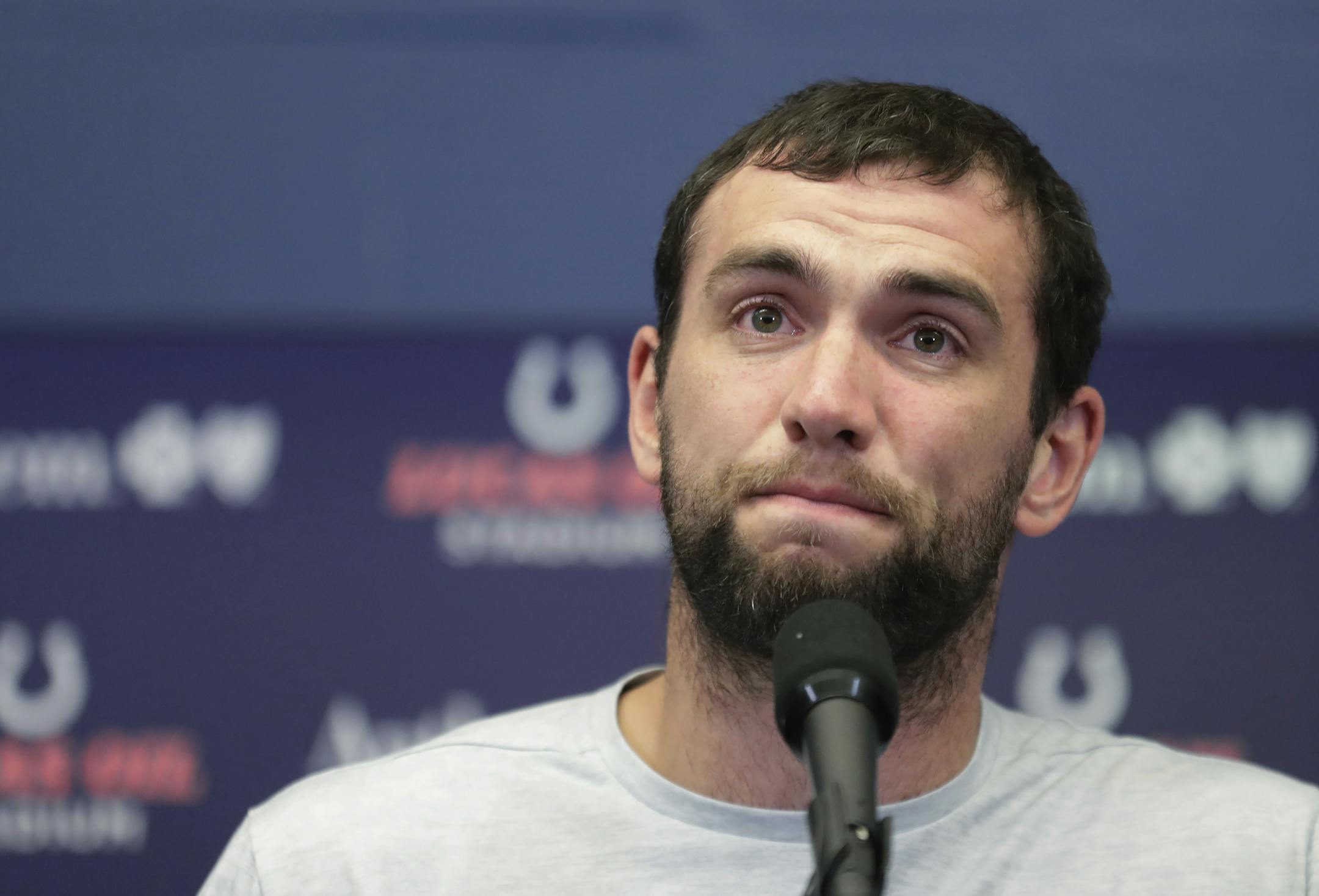 Indianapolis Colts quarterback Andrew Luck speaks during a news conference following the team's NFL preseason football game against the Chicago Bears, Saturday, Aug. 24, 2019, in Indianapolis. The oft-injured star is retiring at age 29. (AP Photo/Michael Conroy)