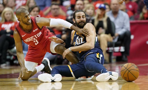 Chris Paul and Ricky Rubio went after a loose ball during a 2019 NBA playoff game. Paul played for Houston at the time and Rubio for Utah.