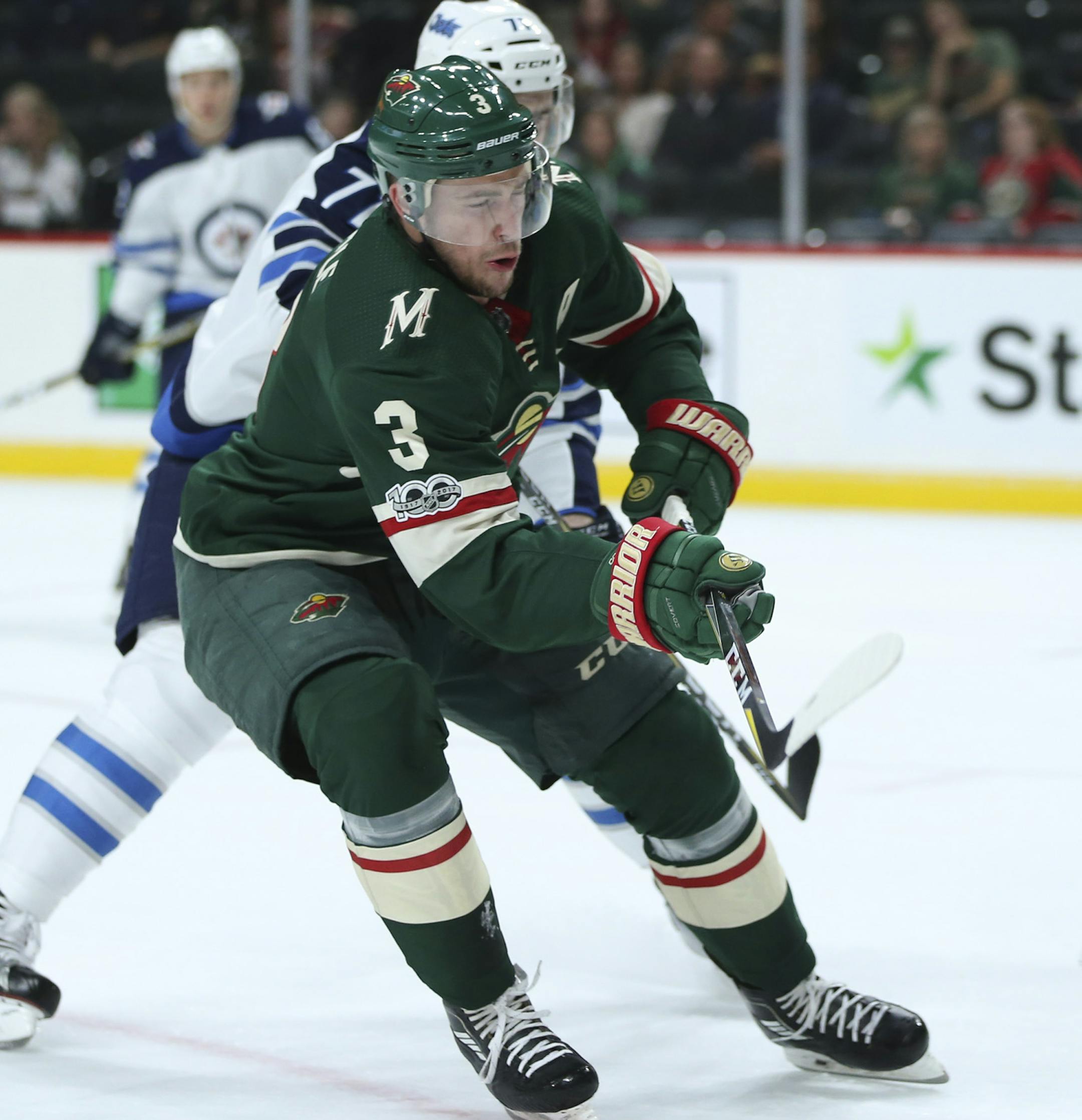 Minnesota Wild center Charlie Coyle (3) tried to knock down the puck being cleared by Winnipeg Jets goalie Connor Hellebuyck (37) in the first period. He was defended bythe Jets' Julian Melchiori (71). ] JEFF WHEELER &#xef; jeff.wheeler@startribune.com The Minnesota Wild faced the Winnipeg Jets in an NHL preseason game Thursday night, September 21, 2017 at Xcel Energy Center in St. Paul.