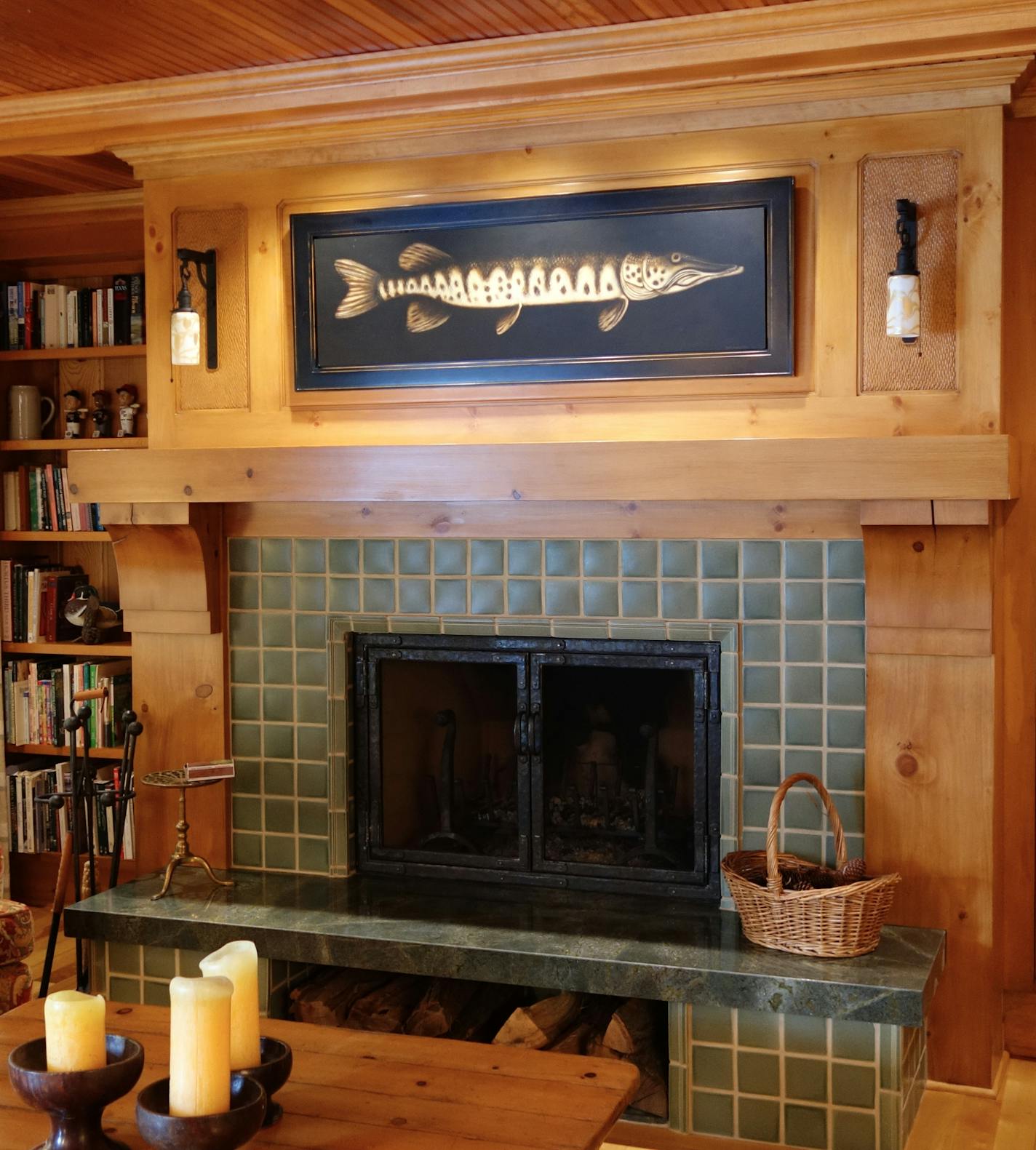 New green tile on the fireplace surround adds Arts & Crafts character to the pine-paneled living room.