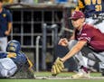 West Virginia's Tevin Tucker, left, beats a tag-attempt by Fordham's John Stankiewicz, right, during an NCAA college baseball regional tournament Frid