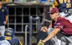 West Virginia's Tevin Tucker, left, beats a tag-attempt by Fordham's John Stankiewicz, right, during an NCAA college baseball regional tournament Frid
