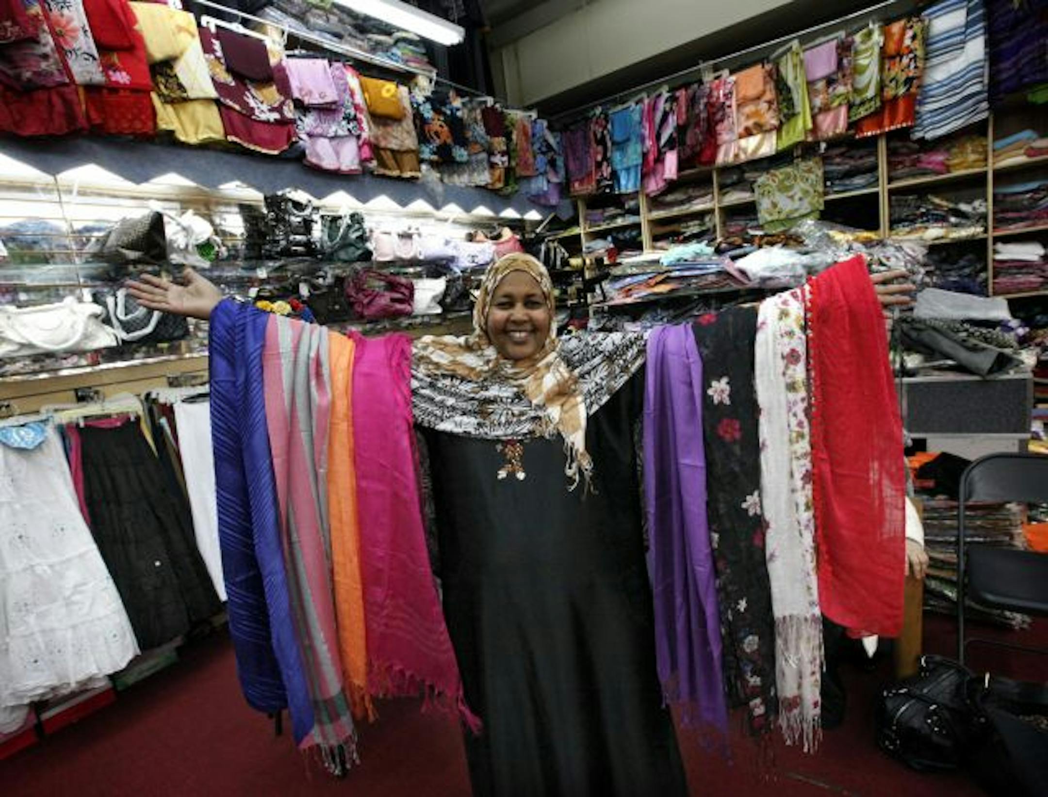 Shopkeeper Marian Ahmed displayed a selection of $5 scarves in her store, Omega Fashion, at the Somali Village Market in Minneapolis.