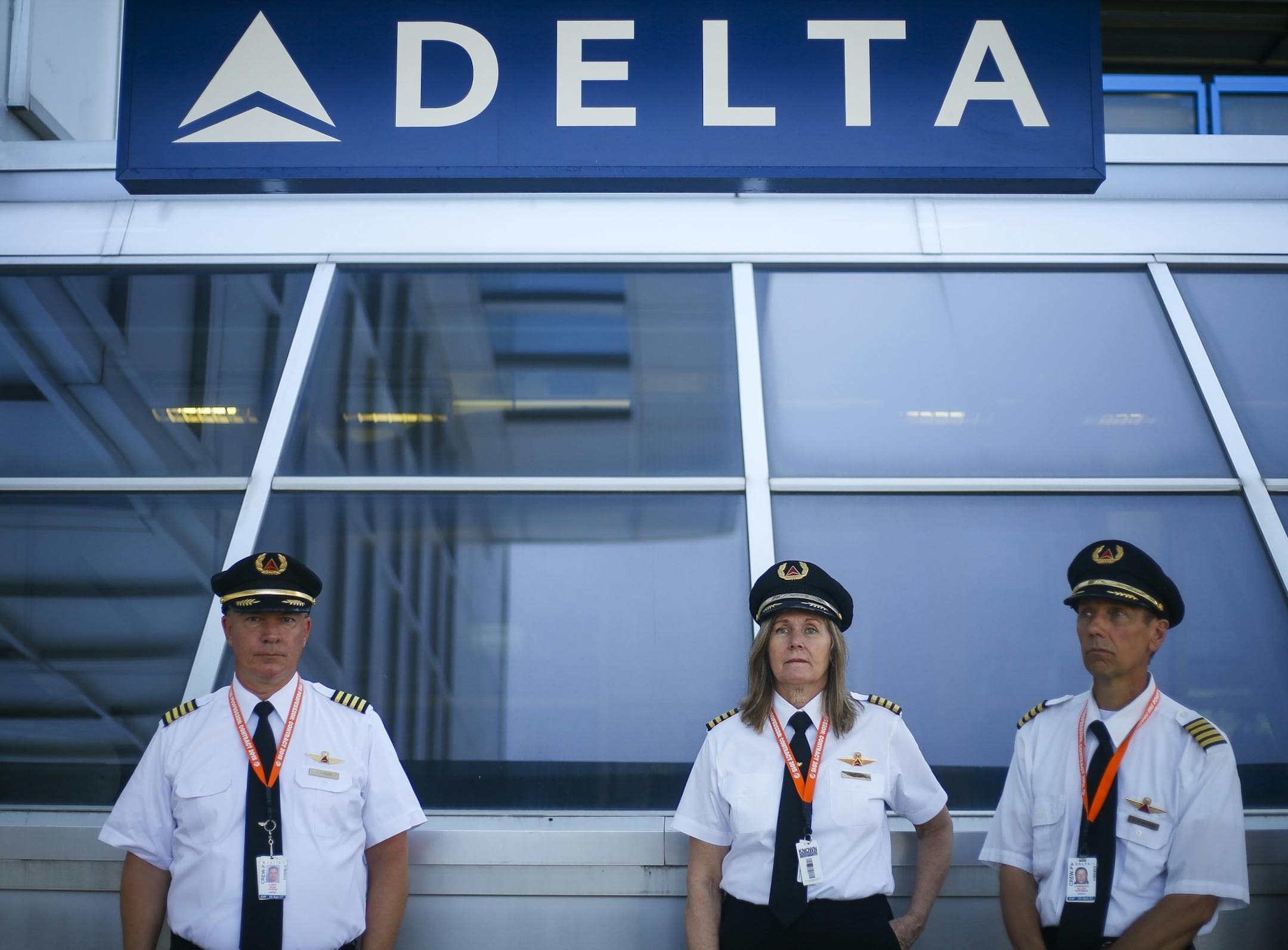 Pilots from Delta Air Lines await instruction before picketing outside of terminal one.