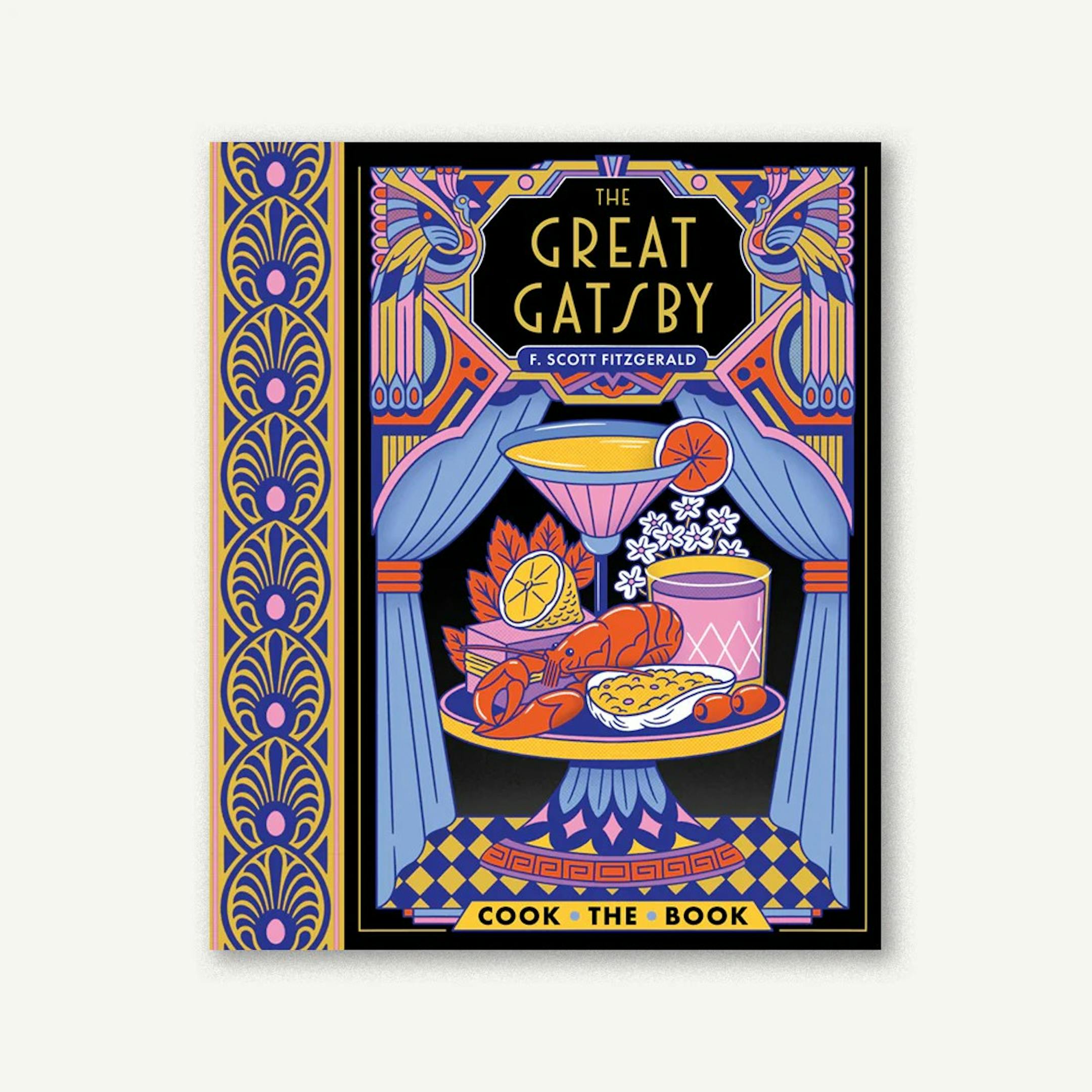 cover of The Great Gatsby edition with recipes is a drawing of food, including lobster, displayed on a cake stand