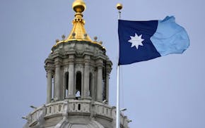 The Minnesota state flag flies amid strong winds as the Minnesota Legislature heads into the final weekend of its 2025 session Friday, May 16, 2025 at