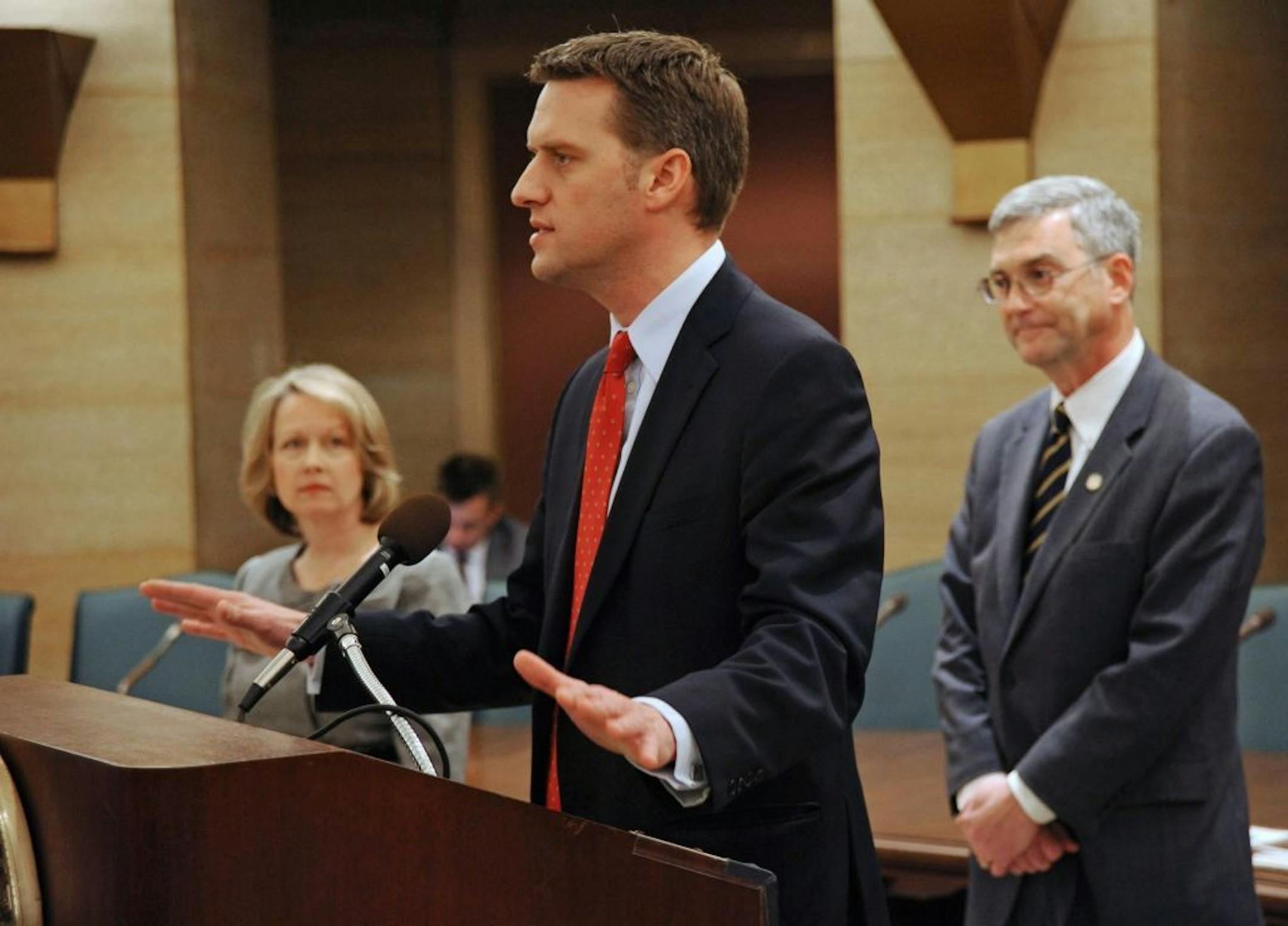 Rep. Kurt Daudt speaks about the state budget as Rep. Jenifer Loon, left, and Sen David Hann look on, Wednesday, Dec. 5, 2012 in St. Paul, Minn.
