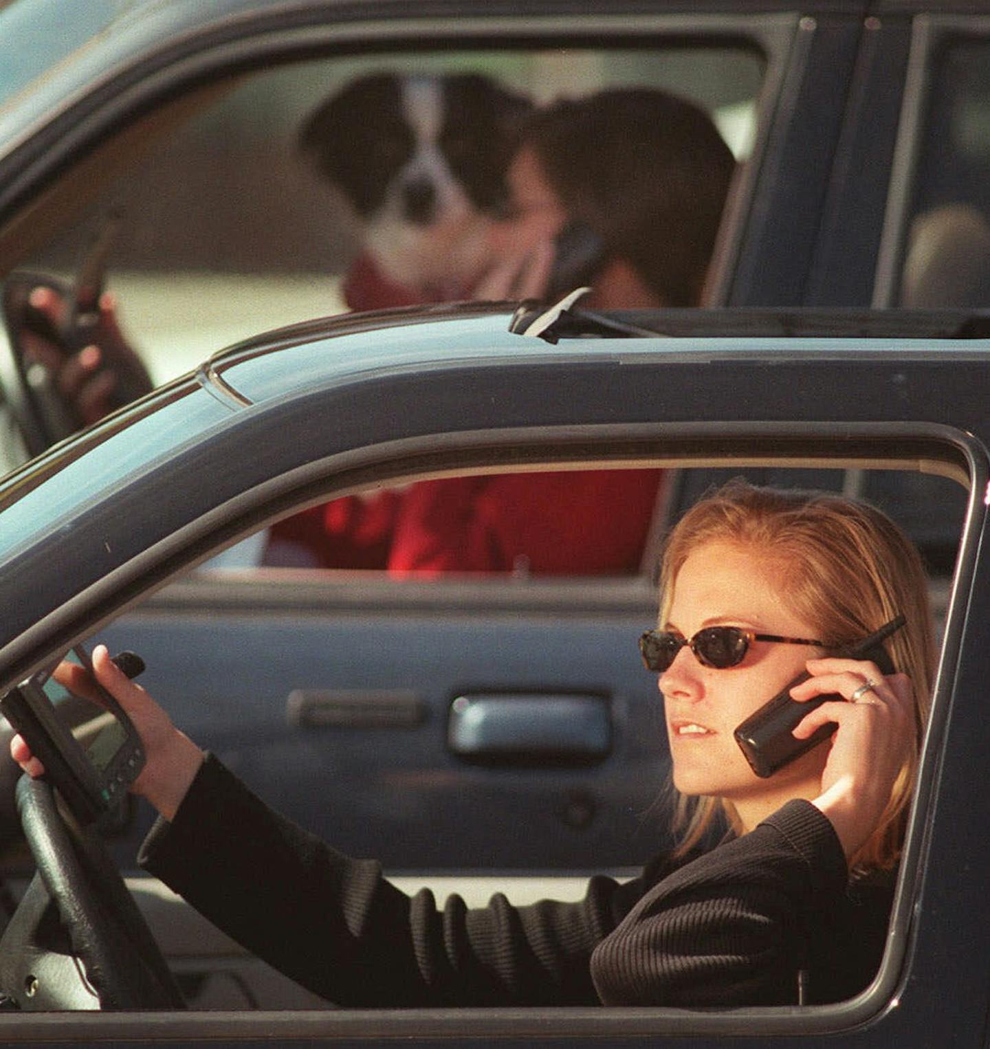 (NNS3-APR19) Drivers have to contend with more and more distractions _ such as cell phones and Palm Pilots _ while driving. SEE ``DISTRACTED-DRIVER'' (Newhouse), transmitted April 19. (Photo illustration by Kirk Speer) ORG XMIT: MIN2014080719465613