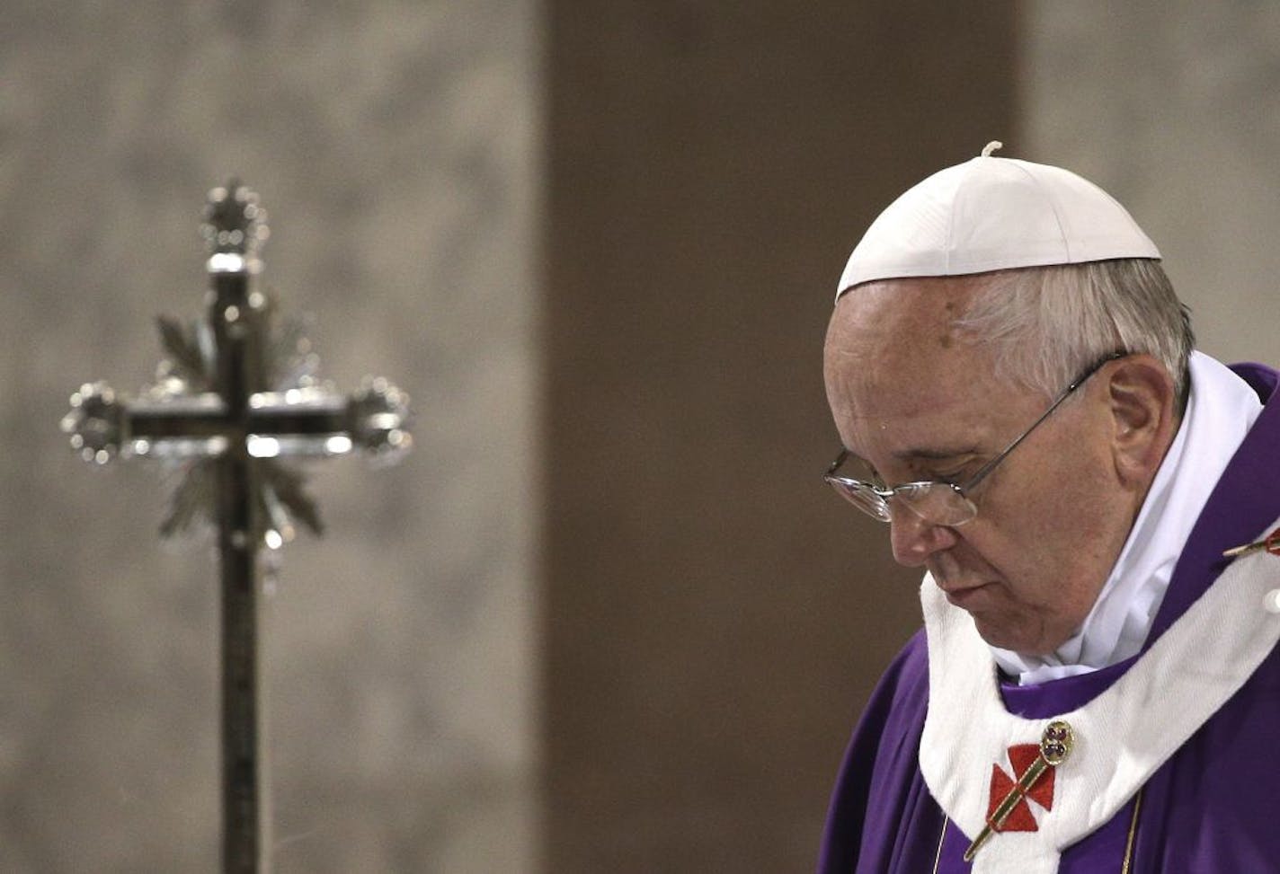 Pope Francis celebrates the Ash Wednesday mass at the Santa Sabina Basilica in Rome, Wednesday, March 5, 2014.