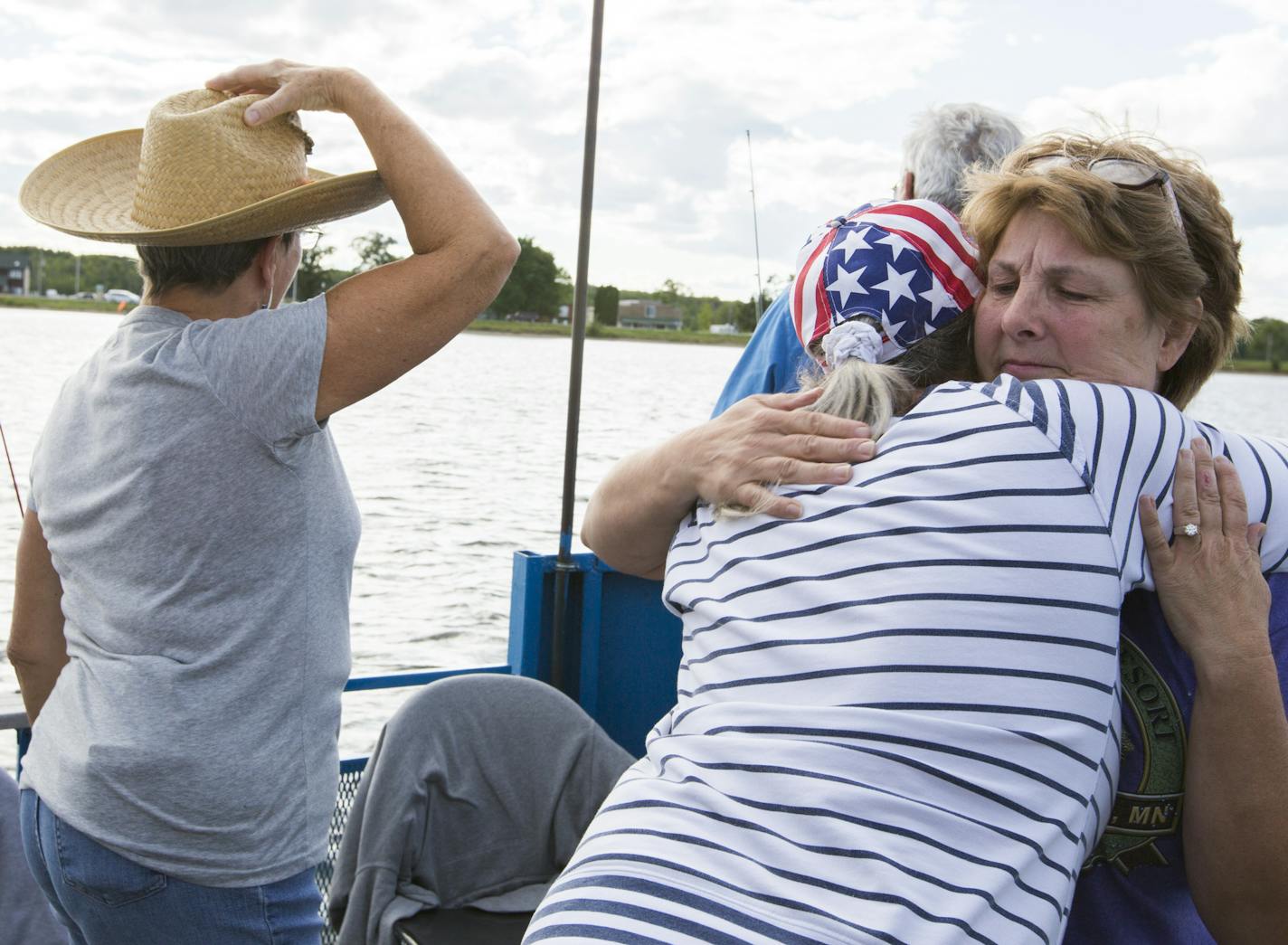 Twin Pines Resort co-owner Linda Eno hugs a customer during a fishing expedition on Mille Lacs Lake Monday, August 3, 2015. ] LEILA NAVIDI leila.navidi@startribune.com /