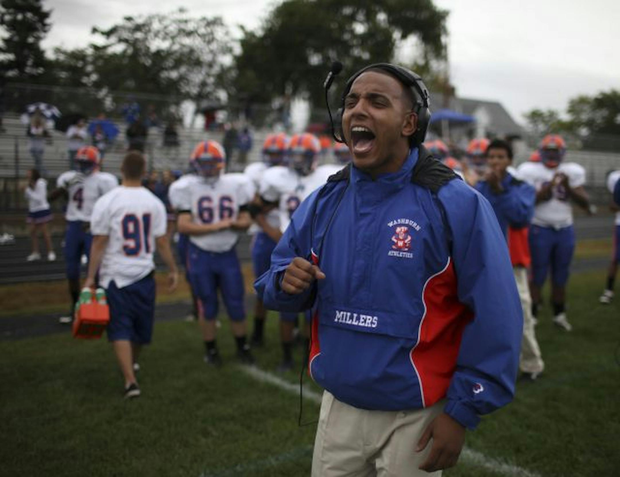 Minneapolis Wasburn coach Giovan Jenkins yelled to his Millers after they scored a first quarter touchdown against South Friday afternoon.