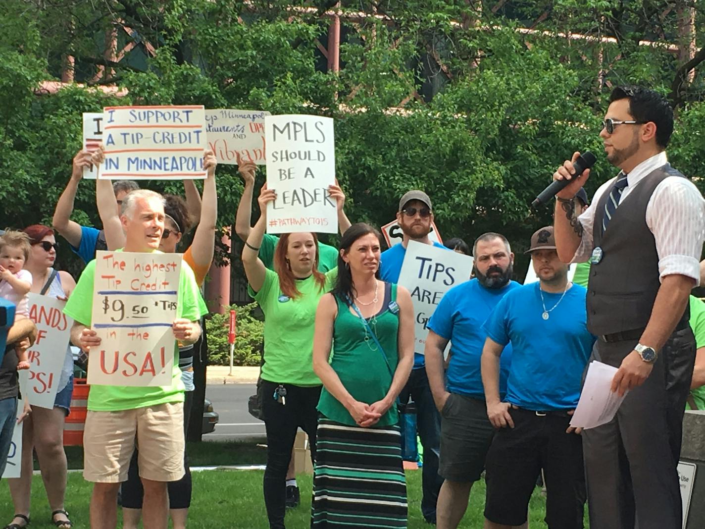 Adam Borgen, a bartender at Smack Shack in Minneapolis, speaks to restaurant workers demonstrating in support of a $15 citywide minimum wage with a tip credit May 16 in Minneapolis.