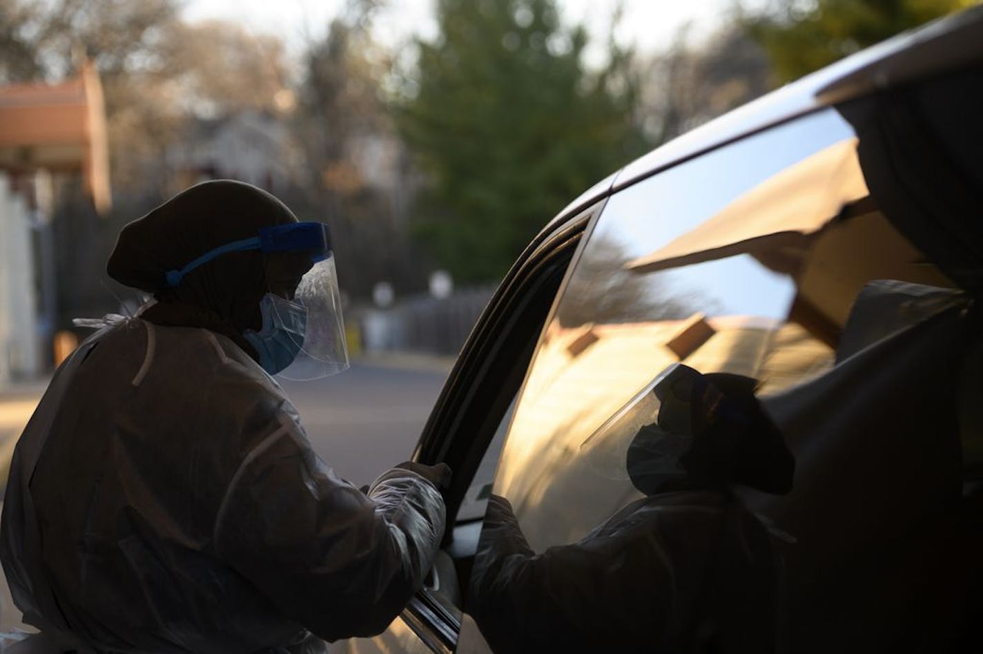 A North Memorial medical worker, who didn't wish to be identified, administered a test to a patient Friday afternoon at North Memorial's drive-up testing site in Robbinsdale.