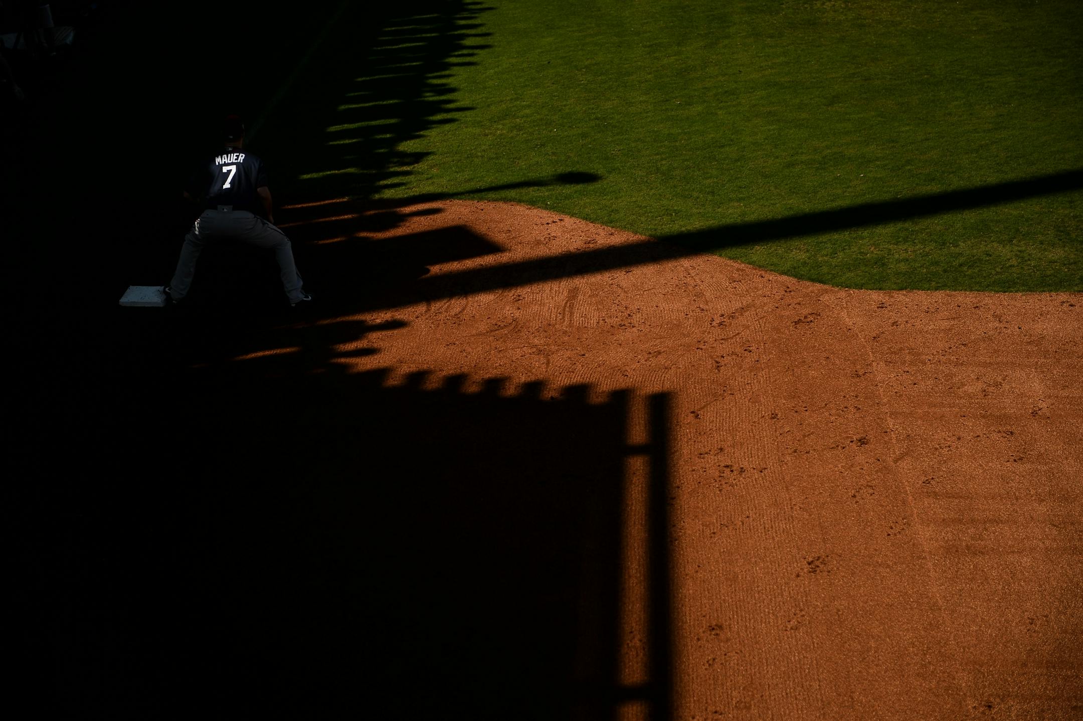 Minnesota Twins first baseman Joe Mauer (7) fielded balls during infield practice Sunday.