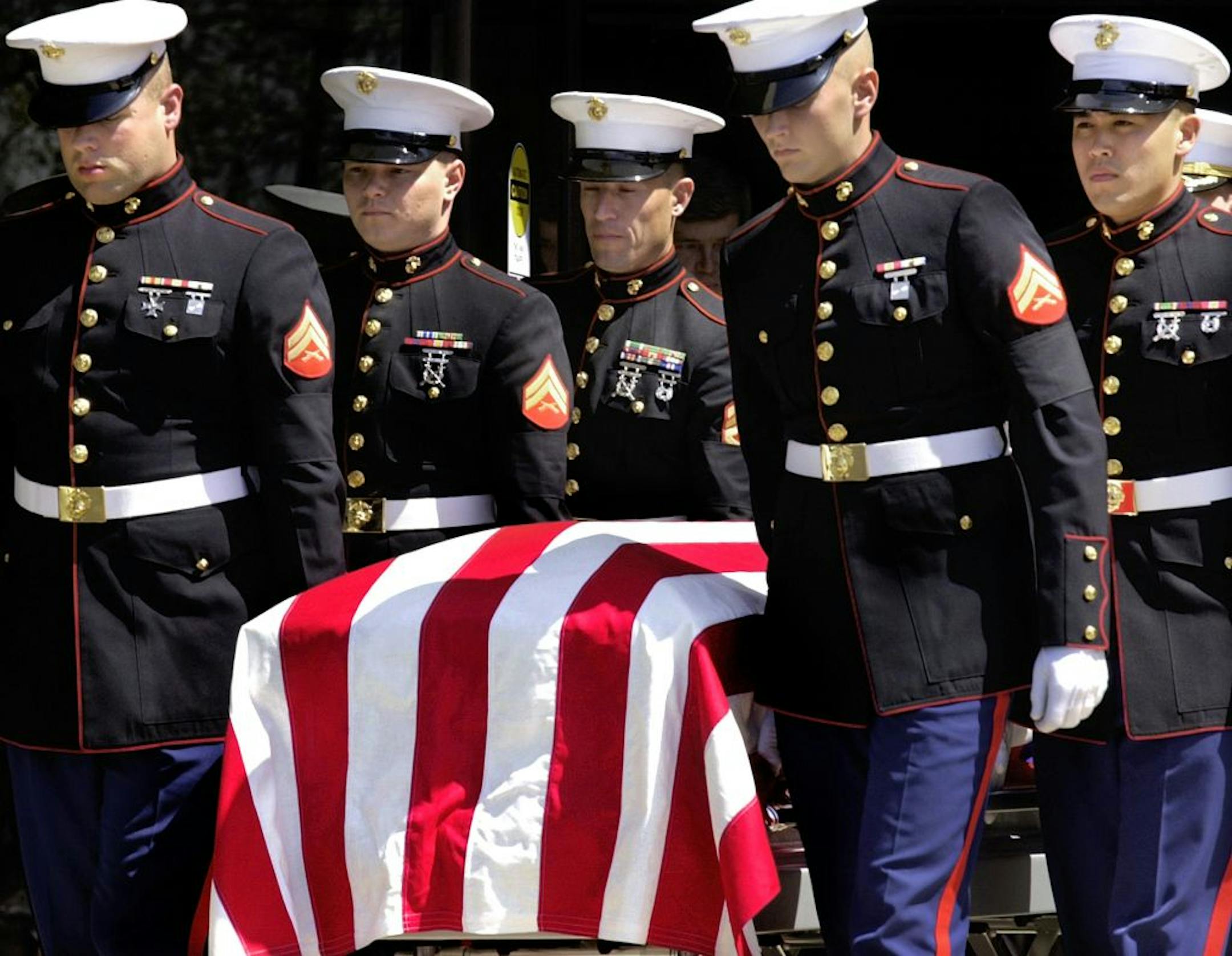 FILE - In this April 23, 2003 file photo, members of the U.S. Marine Corps carry the casket of United States Marine Pvt. Jonathan Lee Gifford at Maranatha Assembly of God in Decatur, Ill. Gifford, 30, was in the 1st Battalion, 2nd Regiment, 2nd Marine Expeditionary Brigade, and was killed just two days into the Iraq war. The last U.S. troops withdrew from Iraq, Sunday, Dec. 18, 2011.