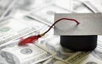 Graduation mortar board cap on one hundred dollar bills concept for the cost of a college and university education. istock photo