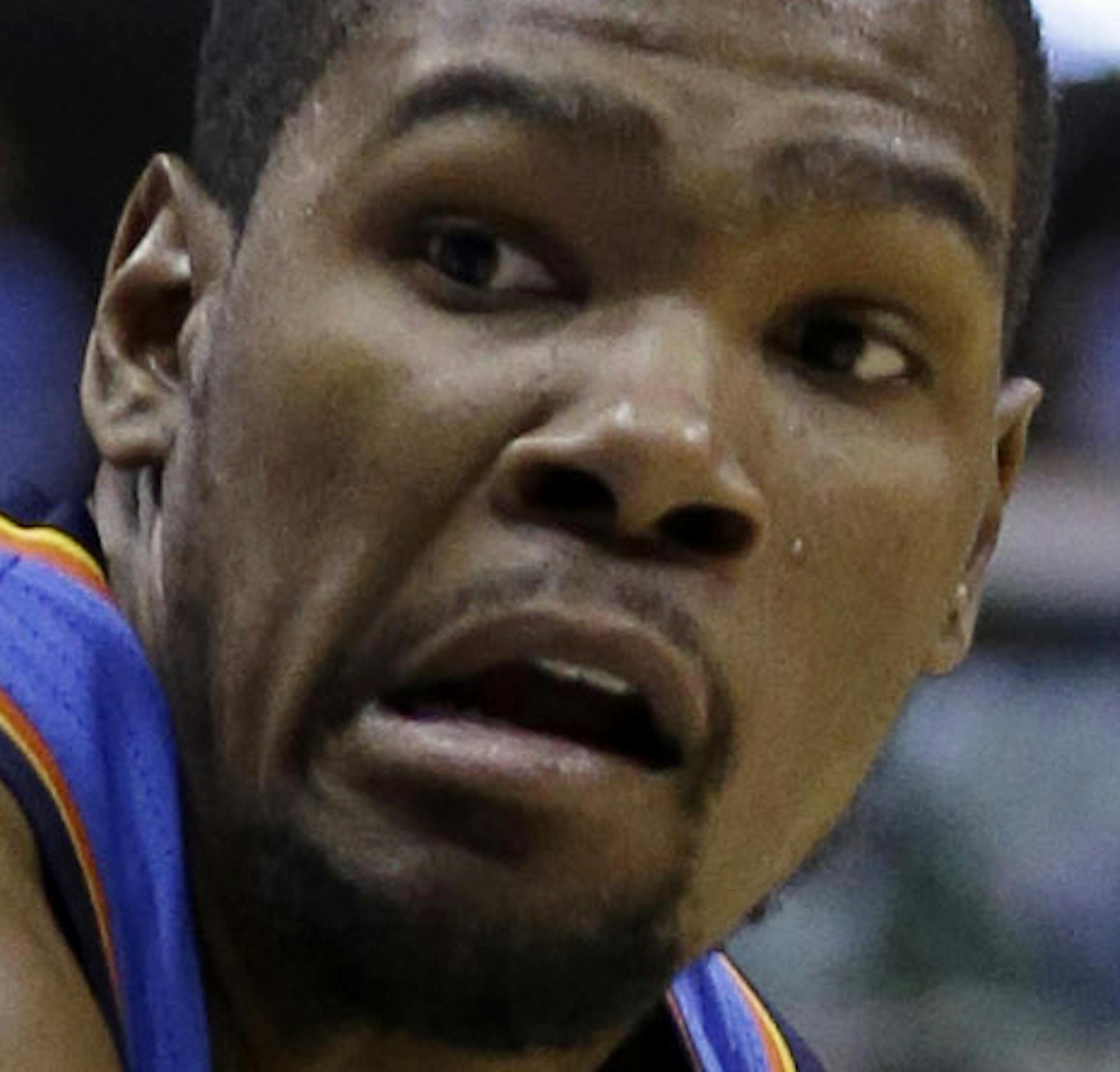 Oklahoma City Thunder forward Kevin Durant (35) drives against Dallas Mavericks forward Dirk Nowitzki (41) of Germany during the first half of an NBA basketball game Sunday, March 17, 2013, in Dallas. (AP Photo/LM Otero)