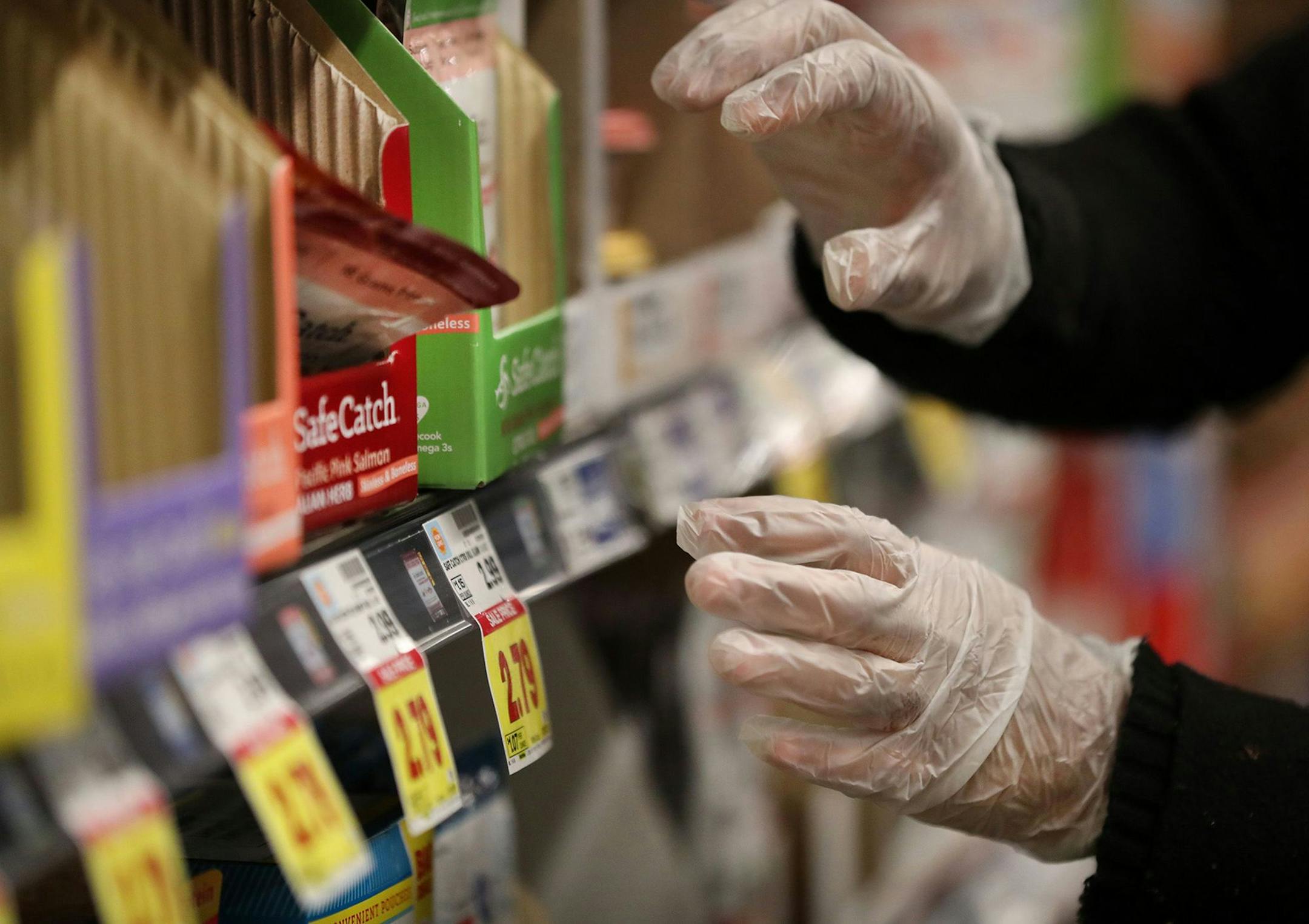 In this file photo, Dreya Stoudemire restocks shelves at Mariano's in Chicago's Bucktown neighborhood on March 19, 2020, amid the coronavirus pandemic. In June, according to federal data released Monday, there were three unemployed people for every job opening in the U.S. (Chris Sweda/Chicago Tribune/TNS) ORG XMIT: 1739689