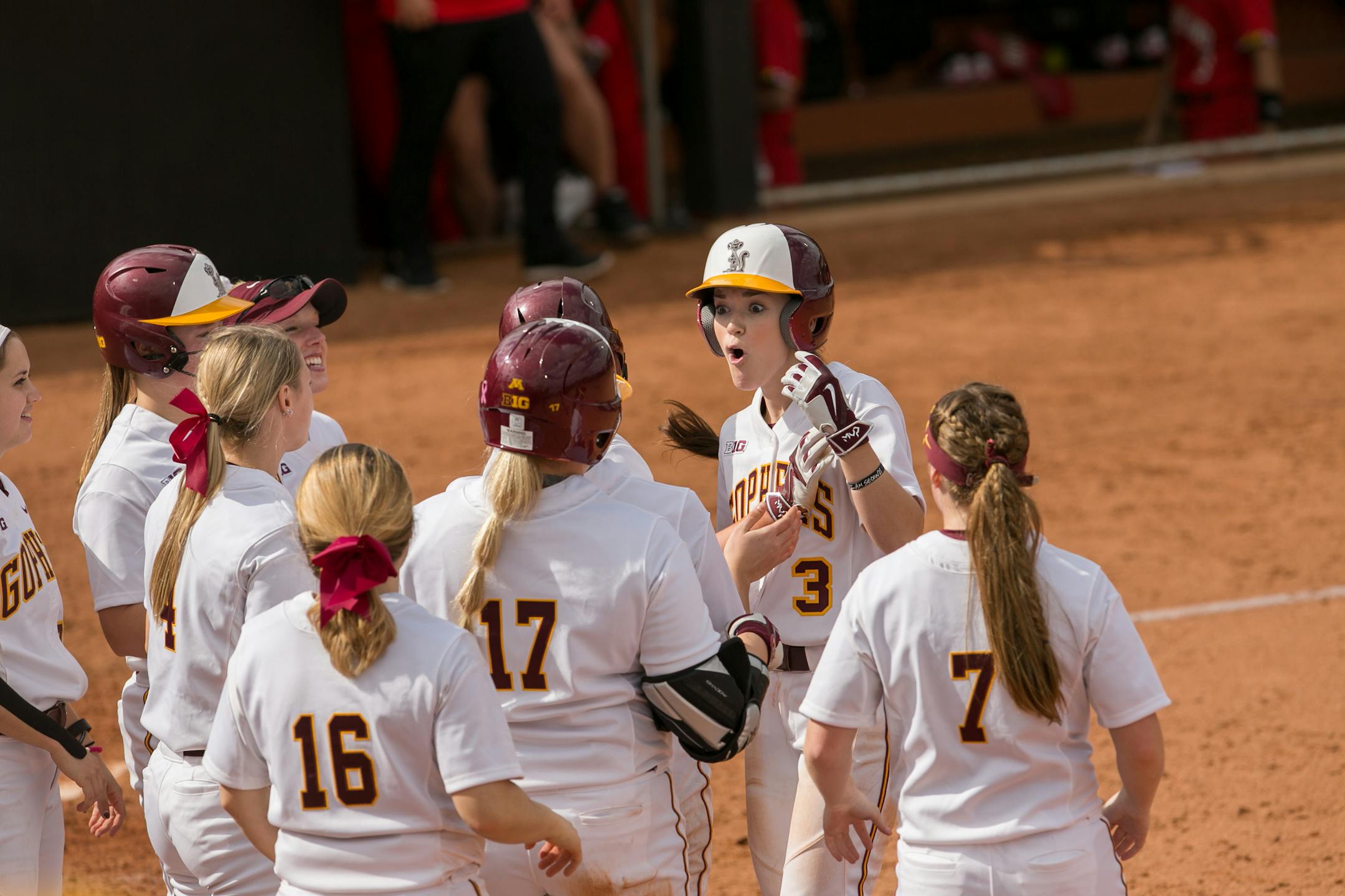 MaKenna Partain celebrated with other members of the Gophers softball team earlier this season.