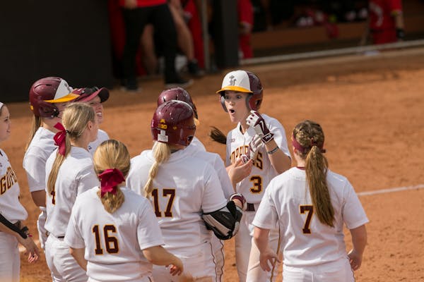 MaKenna Partain celebrated with other members of the Gophers softball team earlier this season.
