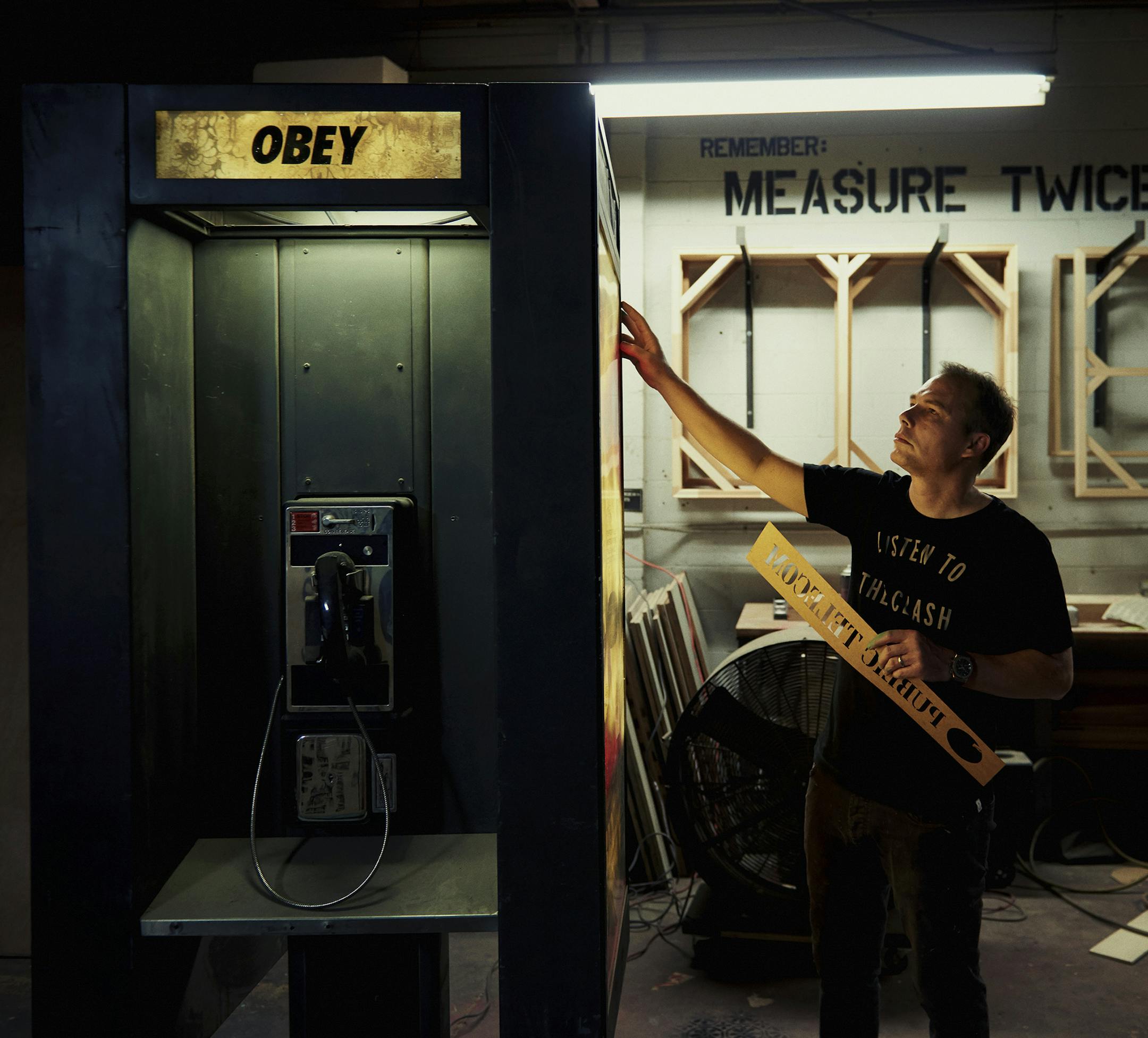 -- PHOTO MOVED IN ADVANCE AND NOT FOR USE - ONLINE OR IN PRINT - BEFORE NOV. 05, 2017. -- Shepard Fairey works on a telephone booth installation piece at his studio, where he is preparing for his upcoming gallery show “Damaged," his biggest to date, in Los Angeles, Oct. 17, 2017. Fairey, creator of the most famous, and ubiquitous, artwork of 2008 -- his stylized "Hope" image of then candidate Barack Obama -- has also created art for activist movements like Occupy Wall Street, Black Lives