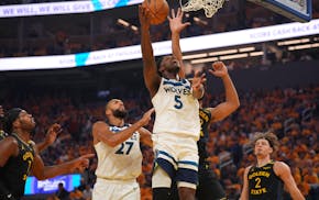 Timberwolves guard Anthony Edwards goes up for a shot against the Golden State Warriors in Game 4 of their NBA Western Conference playoff semifinal se
